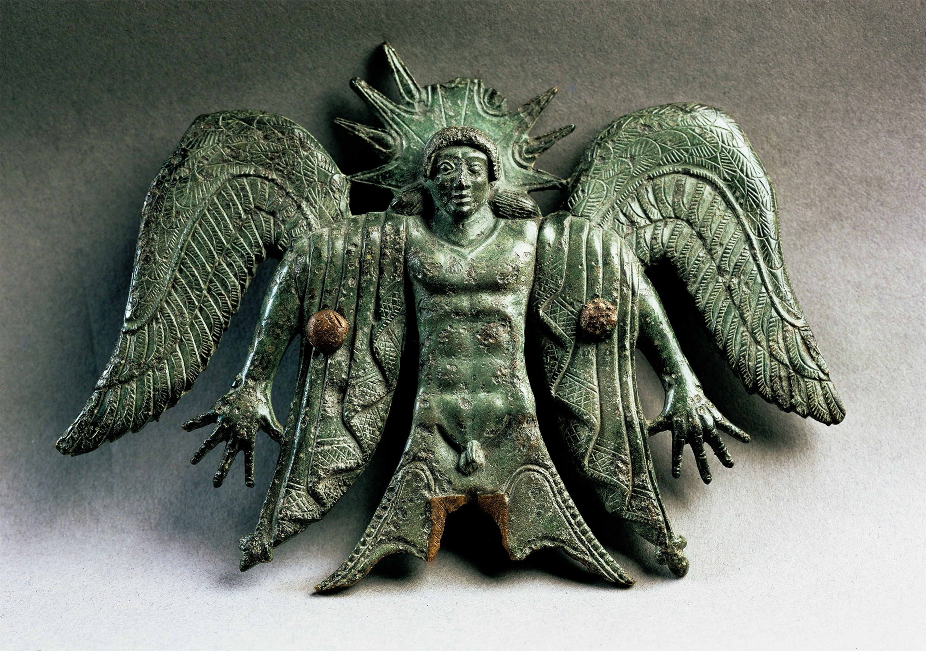 The book refers to Usil, the Etruscan sun god, equivalent to the Greek god Helios. He is depicted here in an Etruscan carriage decoration from the fifth century B.C.