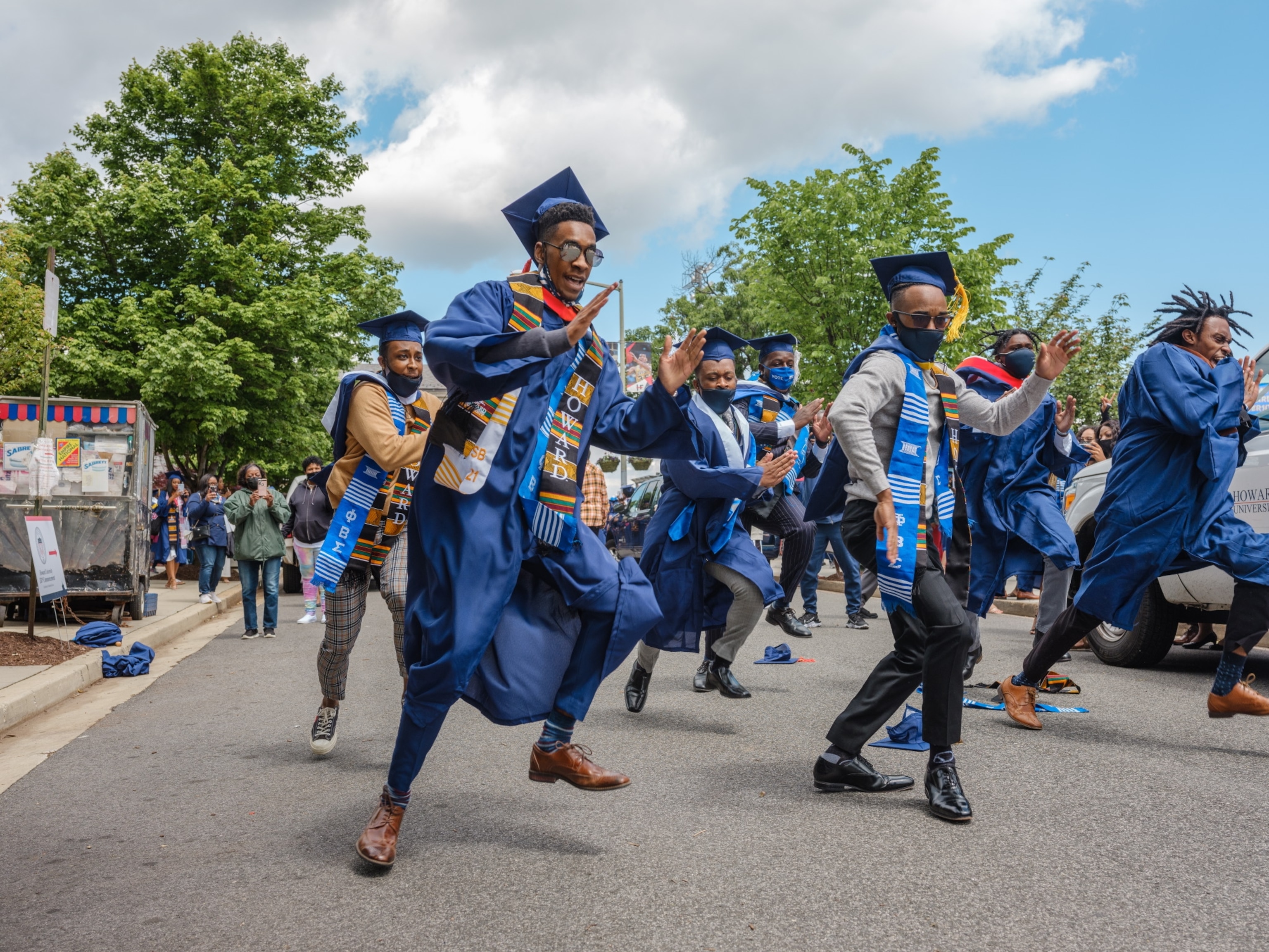 Picture of Phi Beta Sigma fraternity brothers from Howard University celebrating graduation