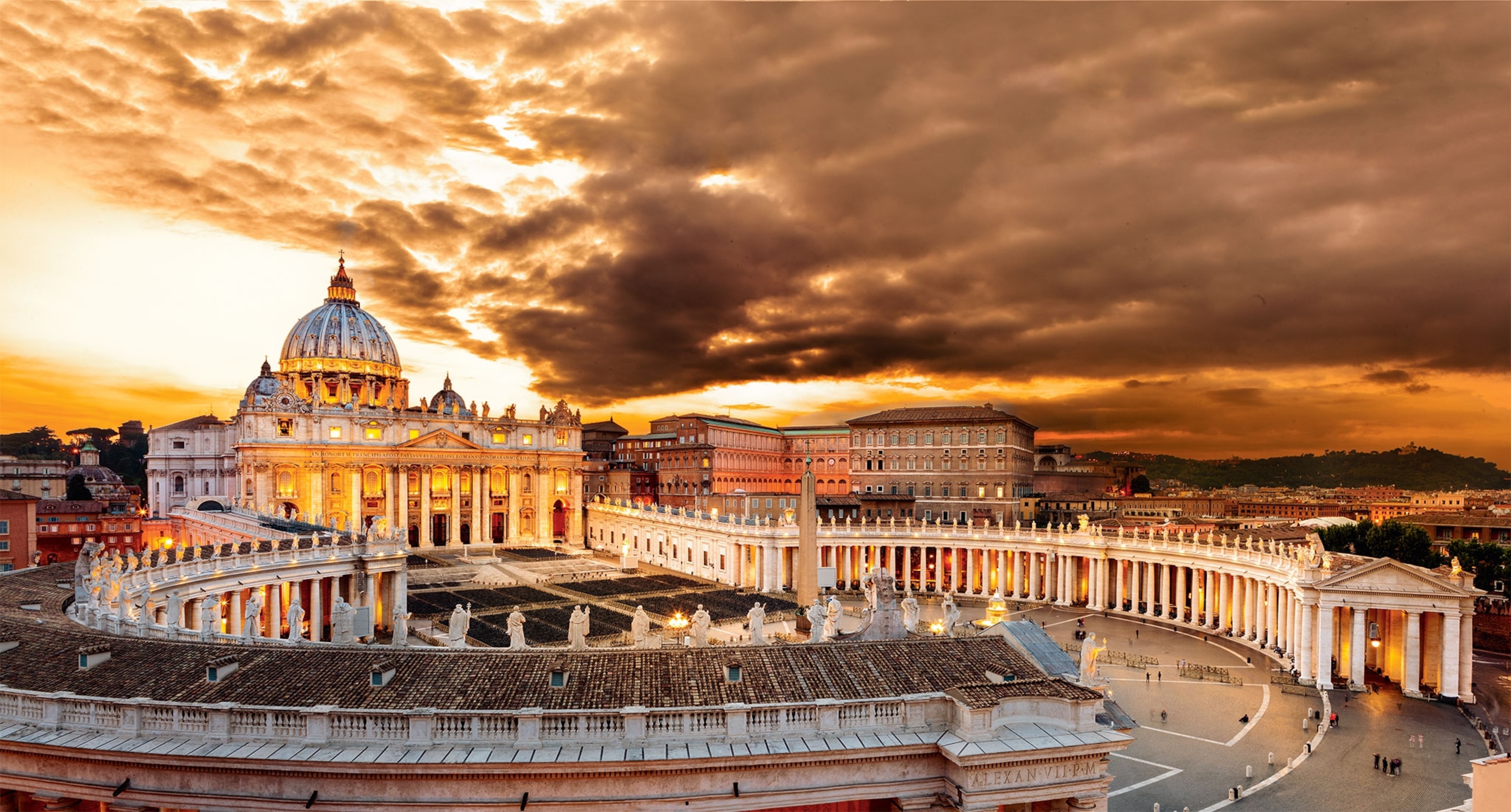 A view of the eastern facade of St. Peter's Basilica and the square at sunset