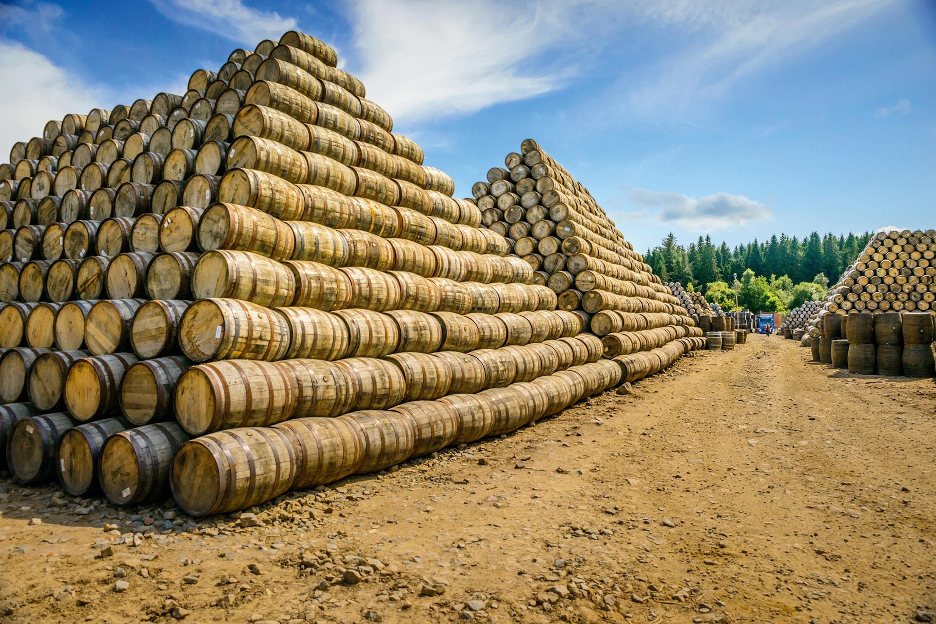 Barrels stacked into large pyramids after the process of coopering.
