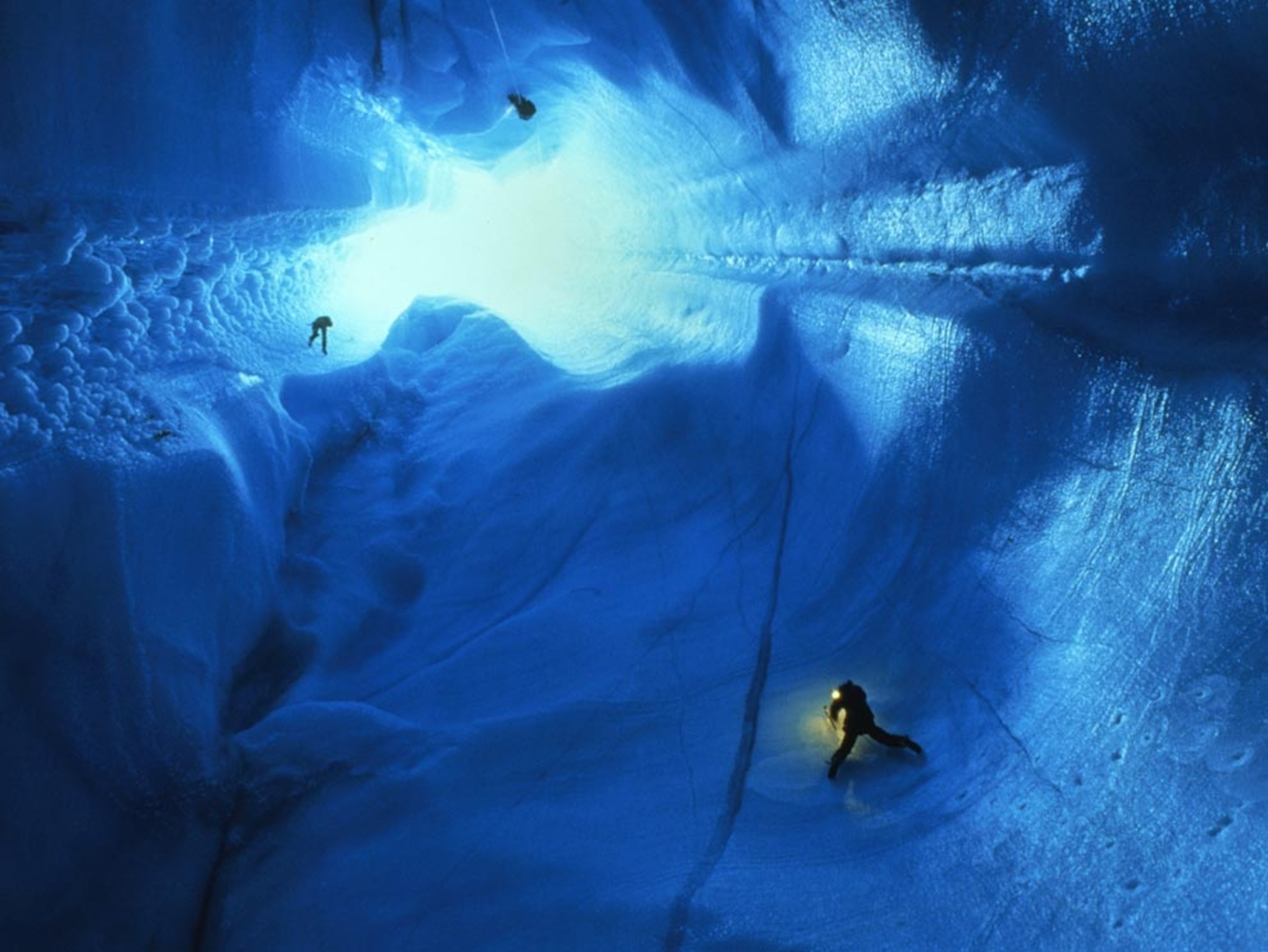 Cavers descend an ice sheet