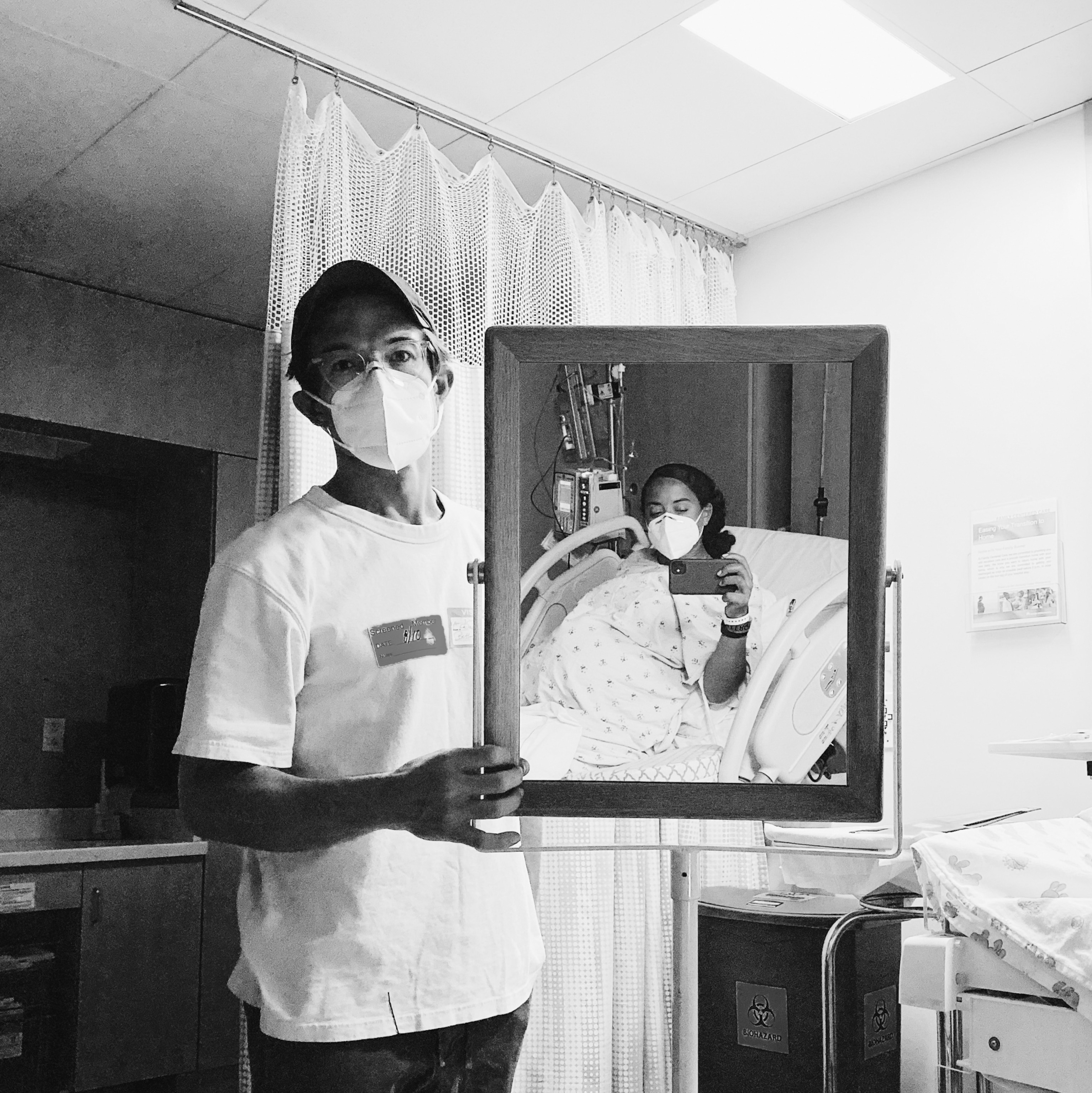 a woman takes a self portrait in a hospital before giving birth in California