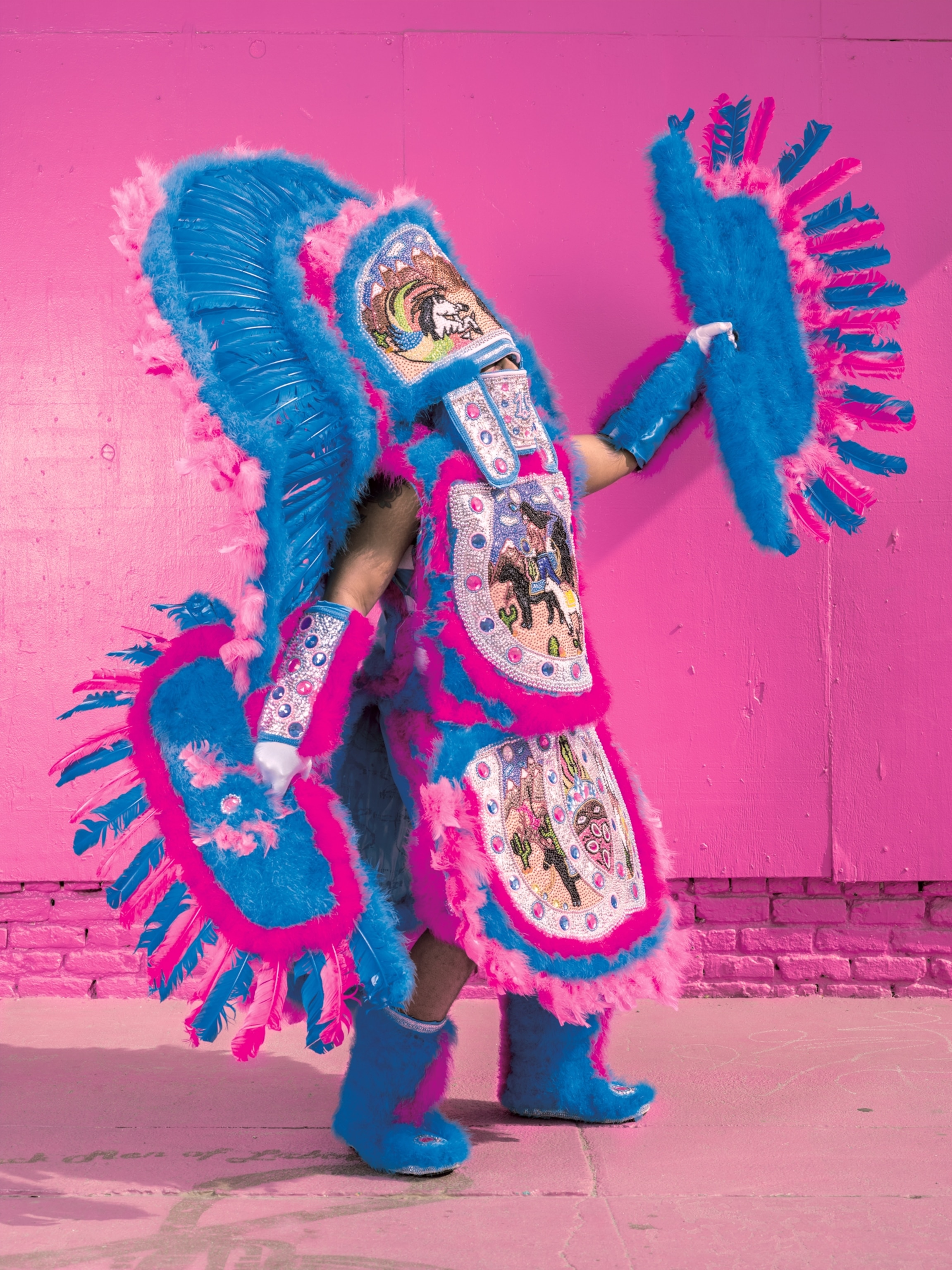 a Mardi Gras costume that references traditional Native American regalia