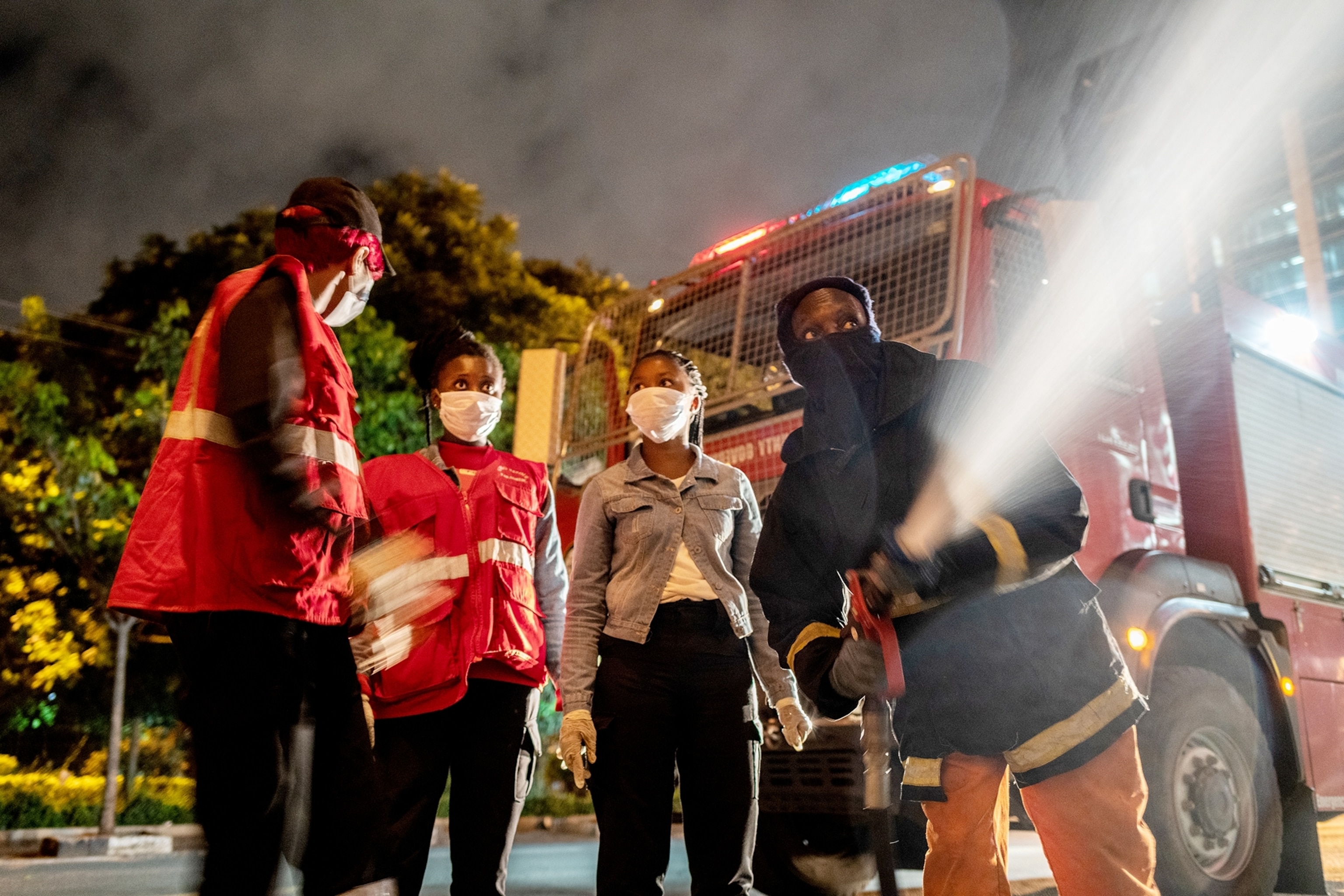 an EMS brigrade spraying down an area