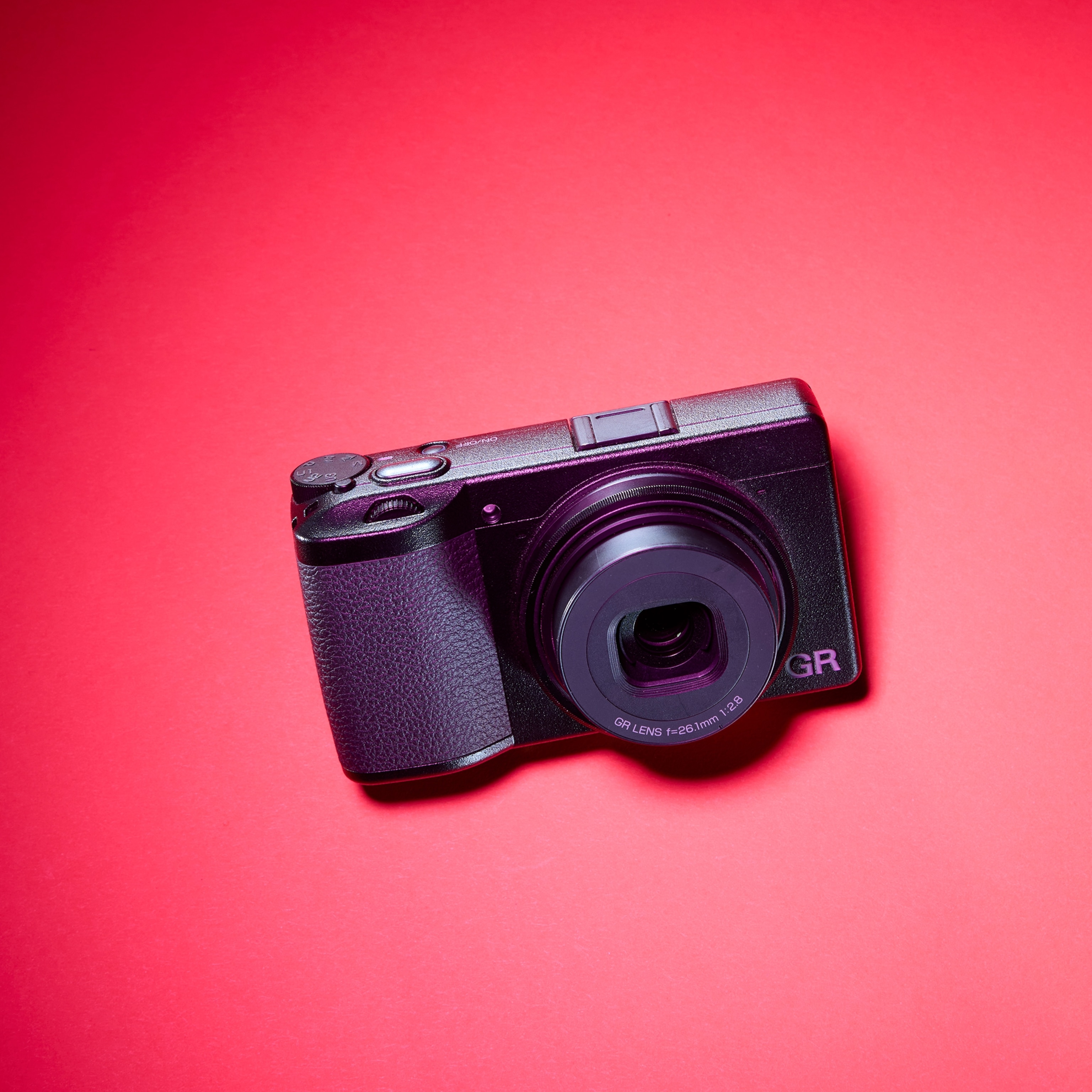 camera Ricoh GRIII on colorful background