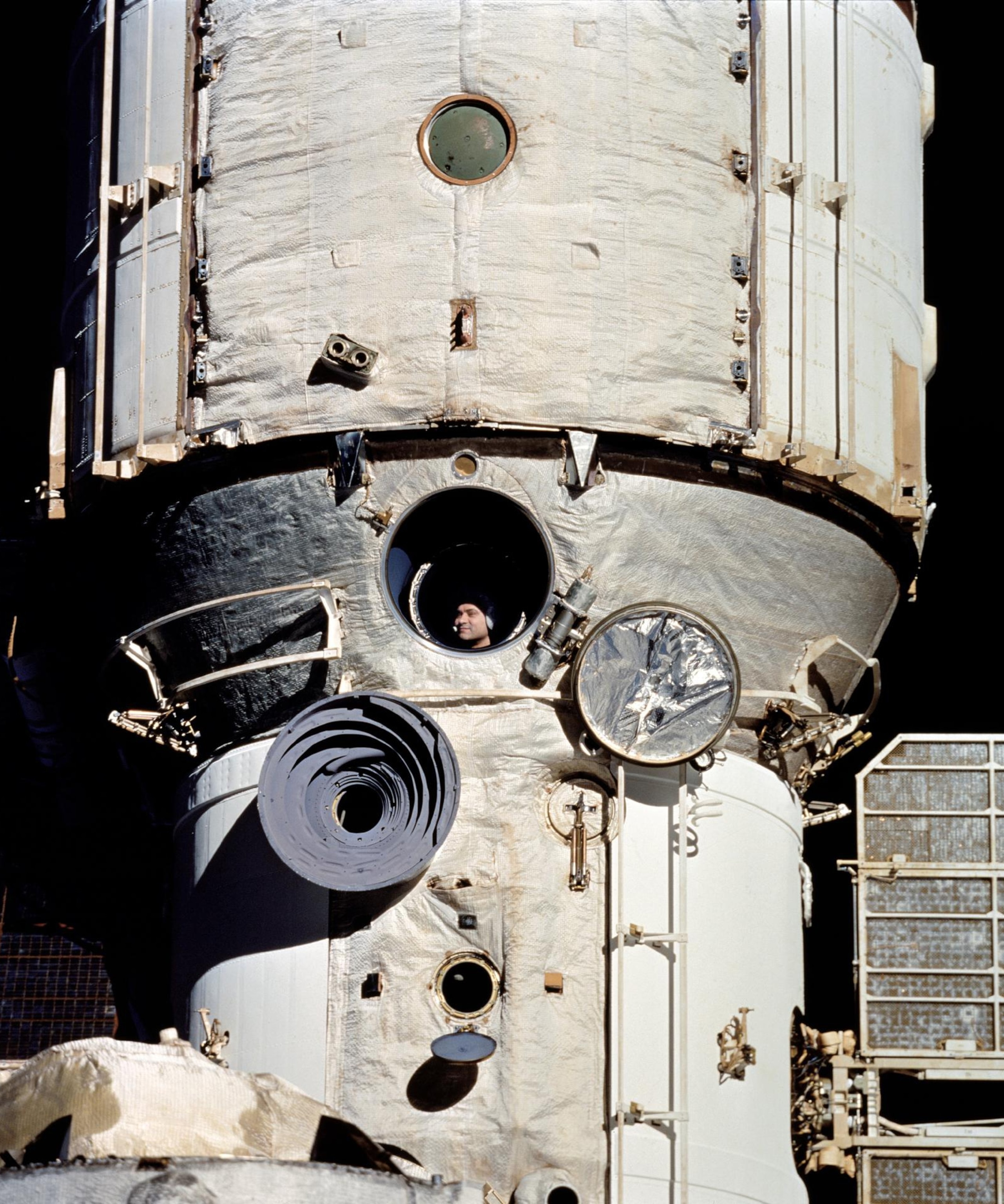 Person looking outside from the space ship.