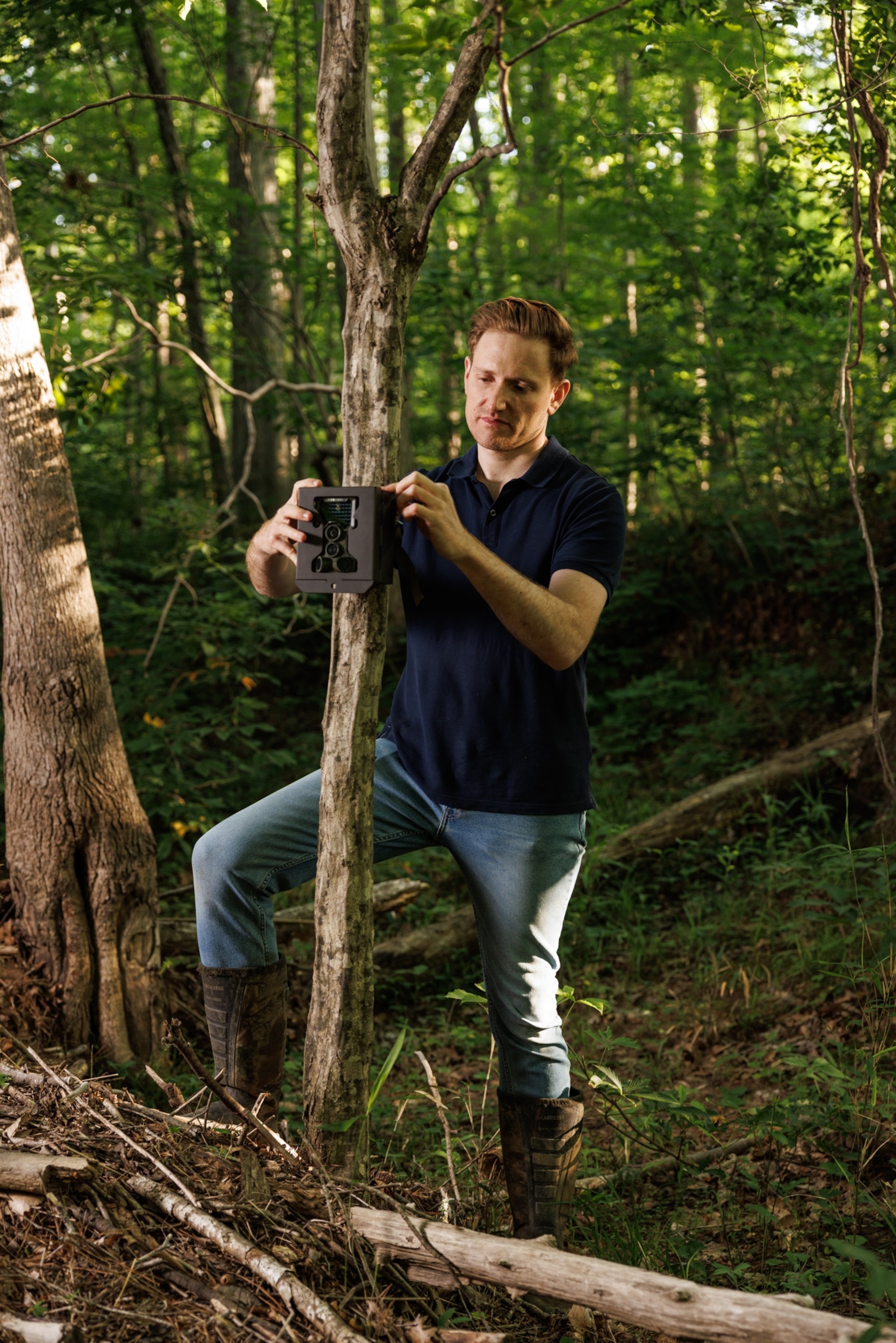 Picture of Blake Morton setting up a series of experiments to study raccoon intelligence