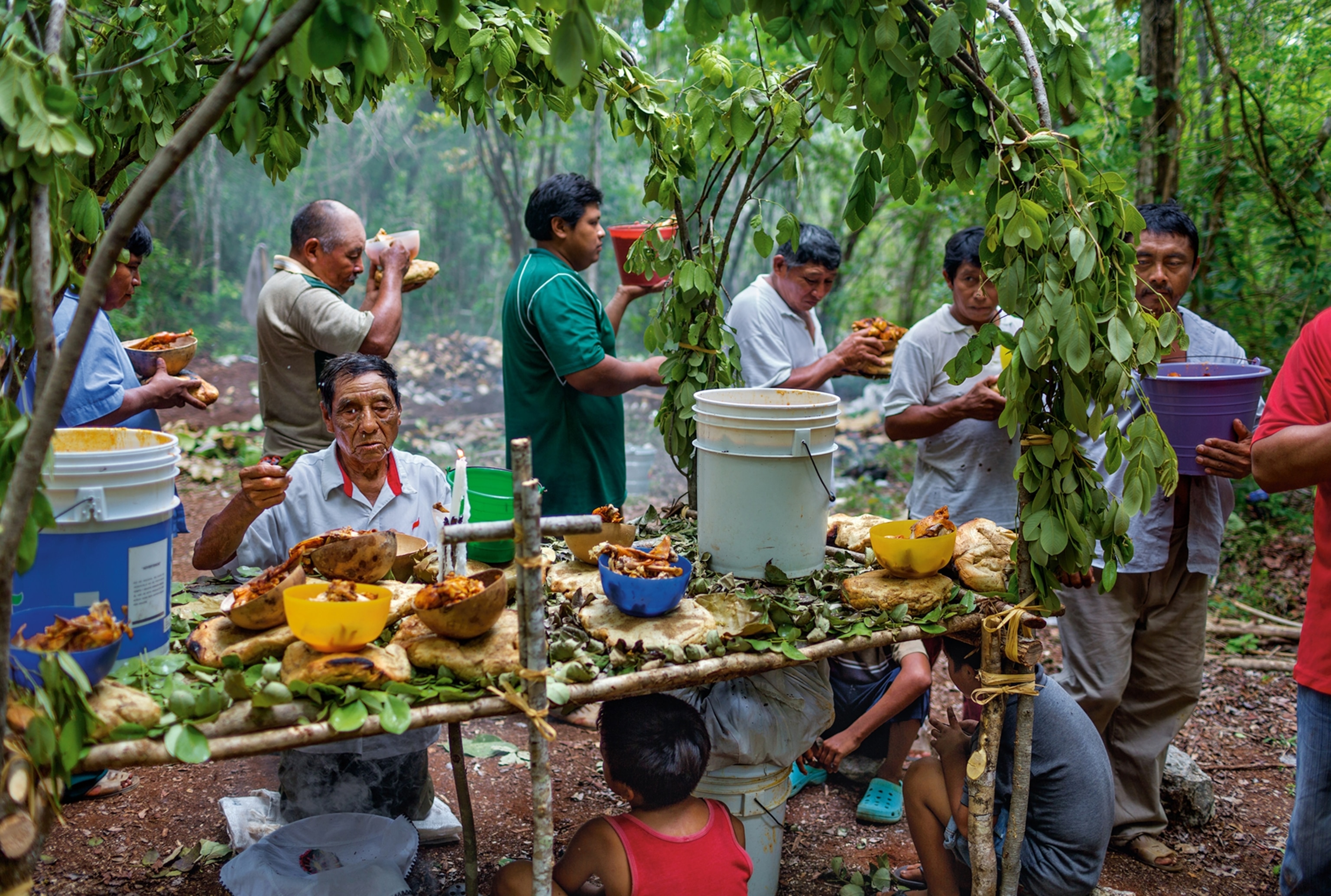 a shaman praying for rain in the village of Yaxuná