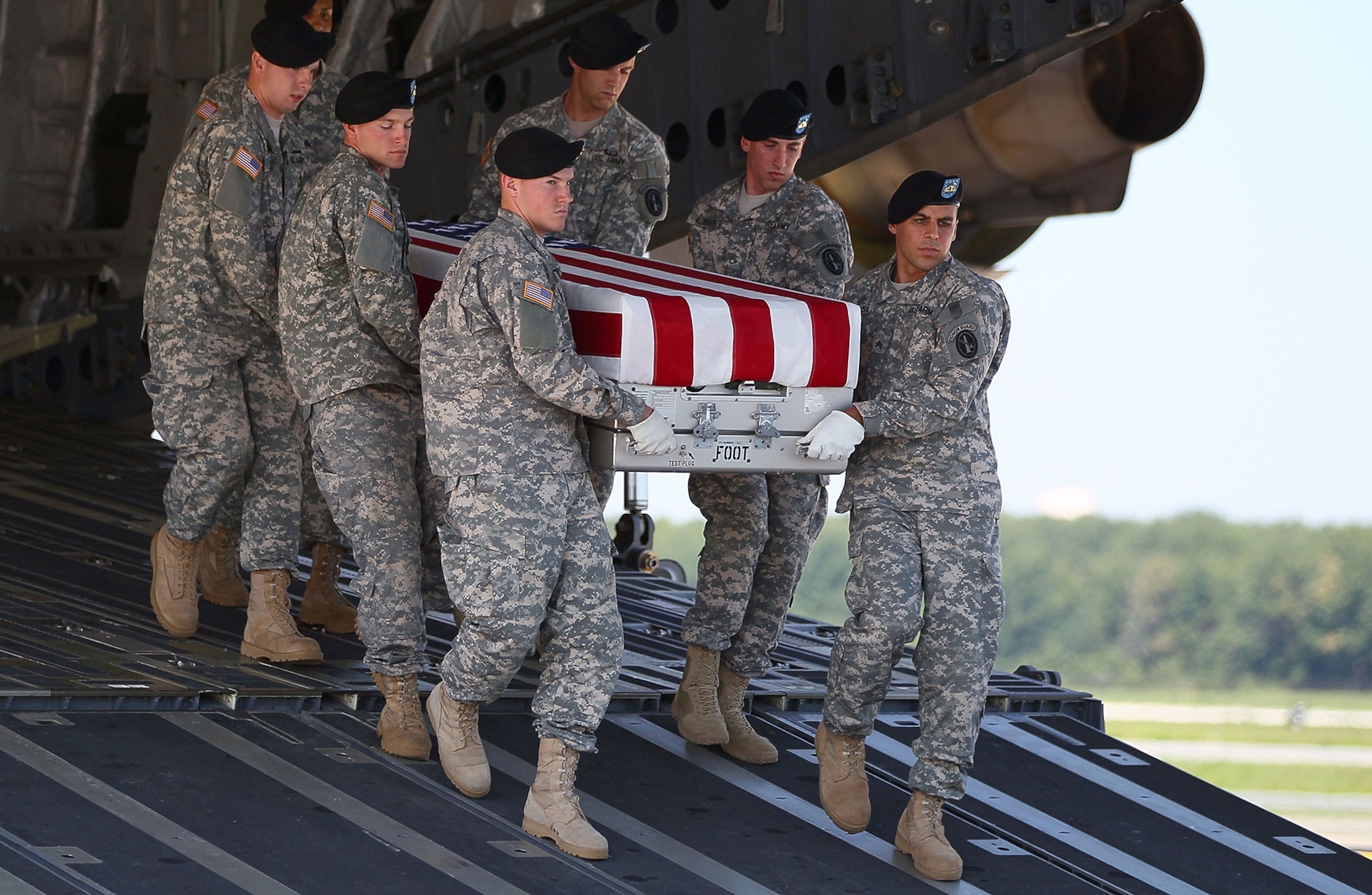 U.S. Army carry team moves the transfer case