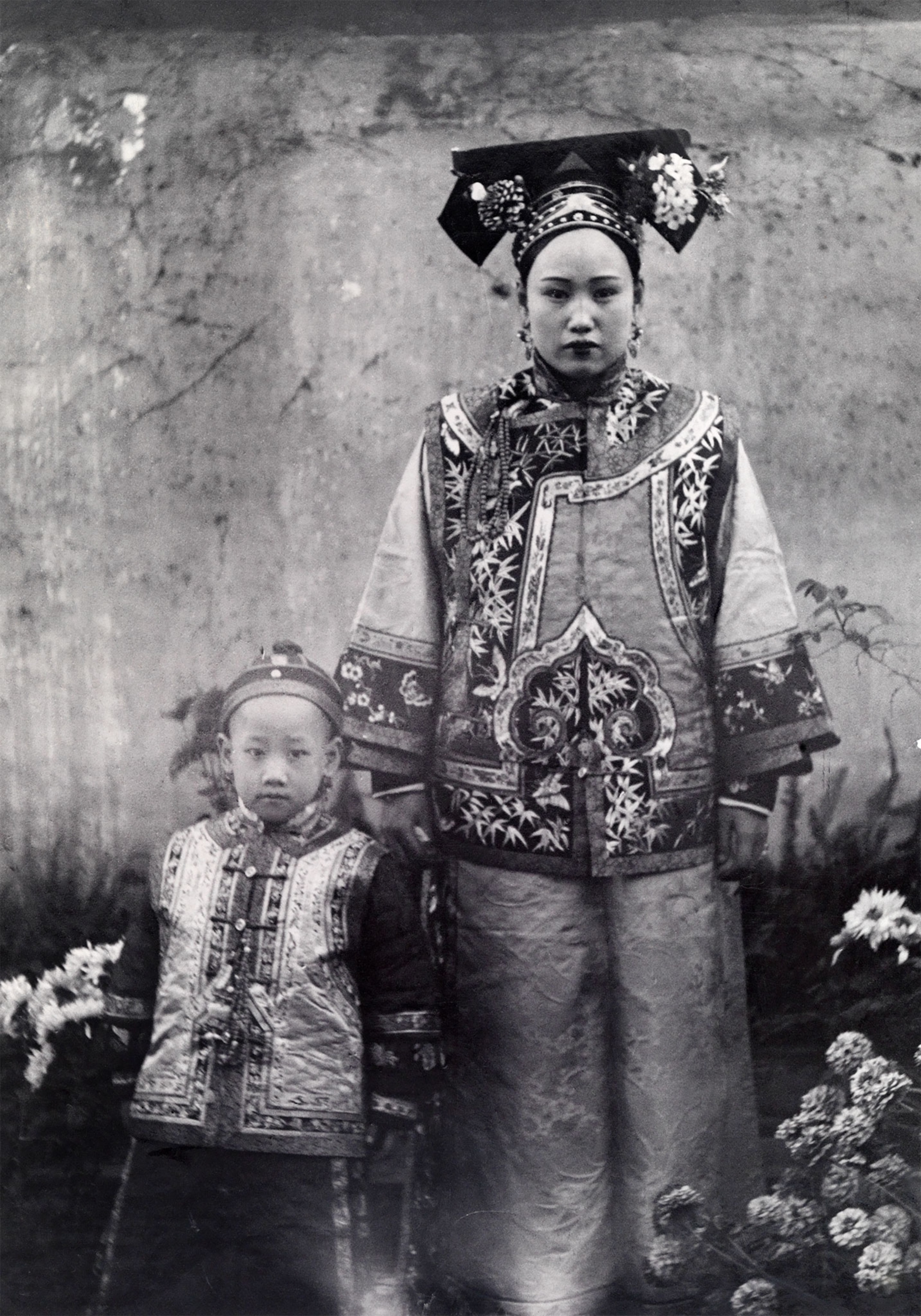 a Chinese mother and child in traditional attire