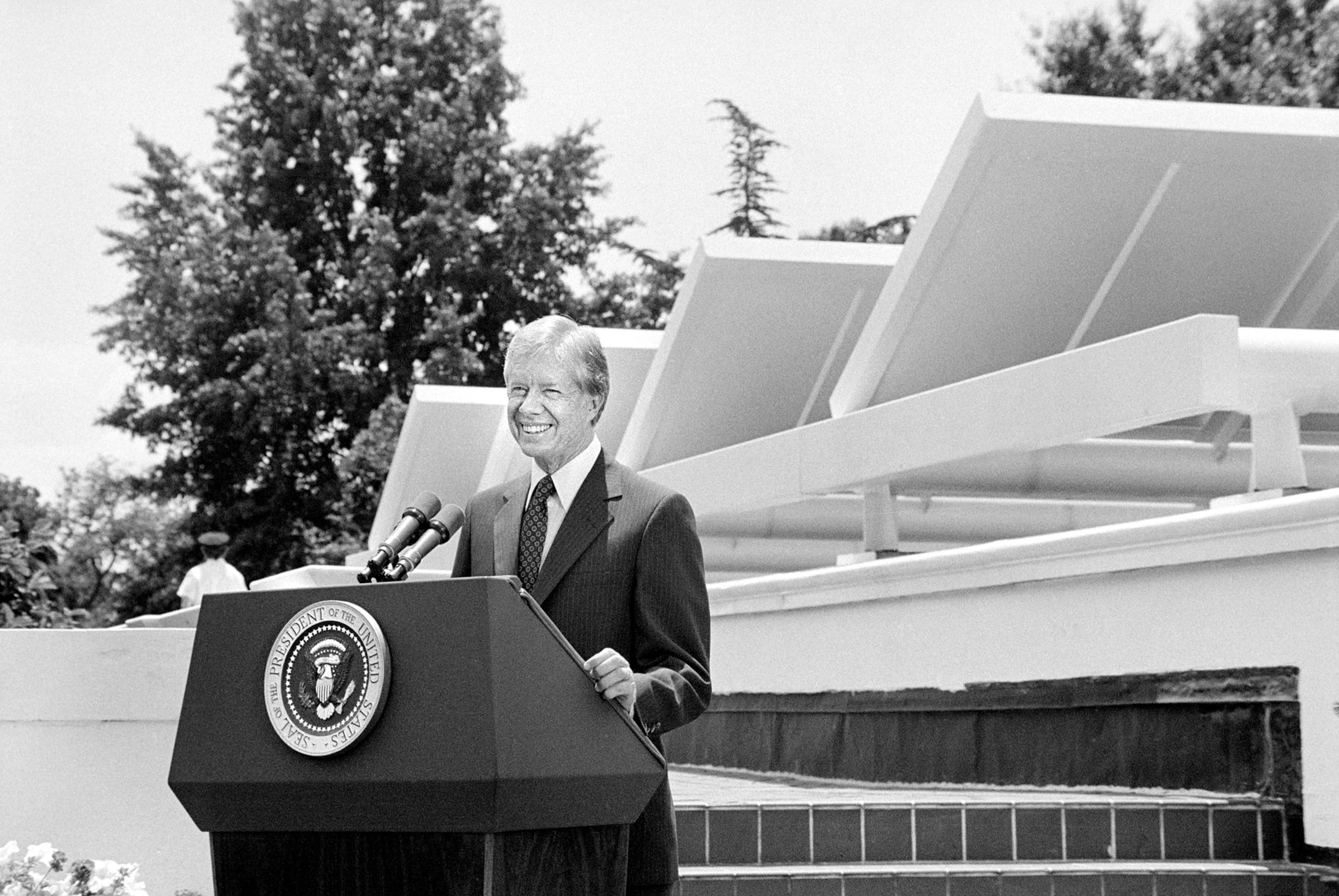 Former President Jimmy Carter speaking in front of Solar Panels placed on West Wing Roof of White House