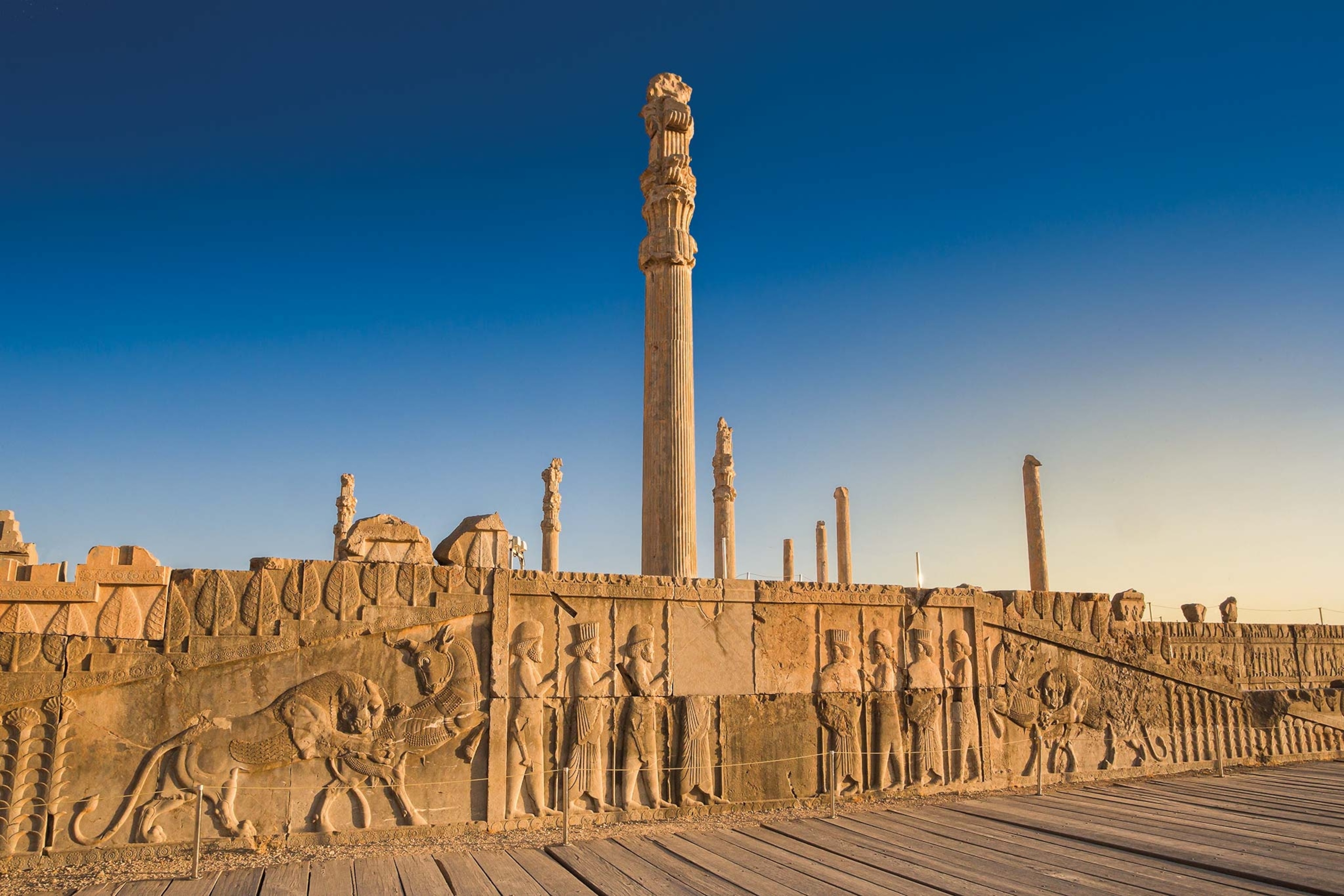 The Apadana (Audience Hall) at Persepolis was begun in the sixth century B.C. by Darius the Great and later completed by his son, Xerxes. Reliefs on the frieze covering the eastern stairs depict eight soldiers flanked by figures of a bull being mauled by a lion.