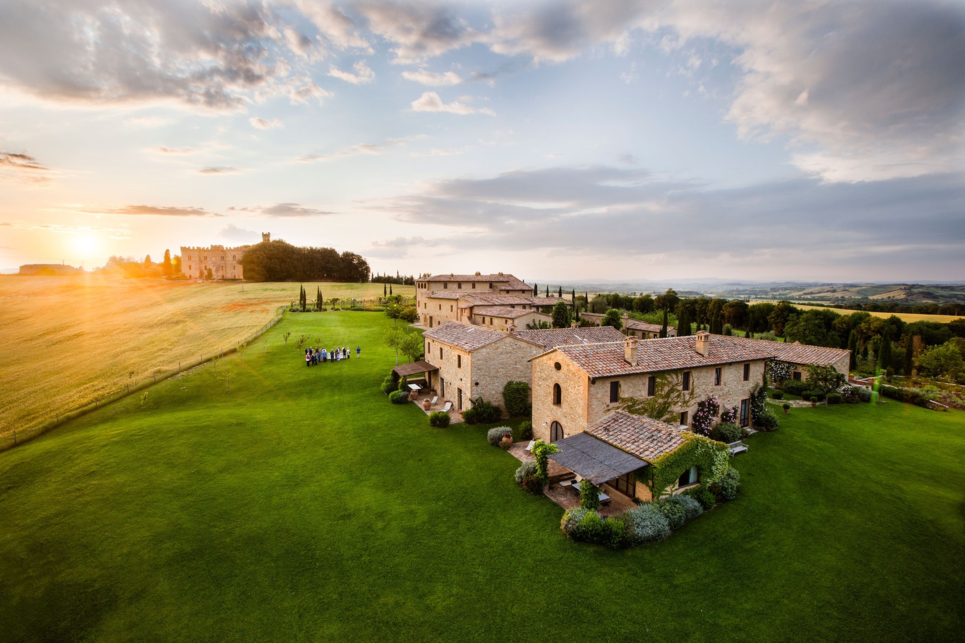 villas in the Tuscany countryside at sunset