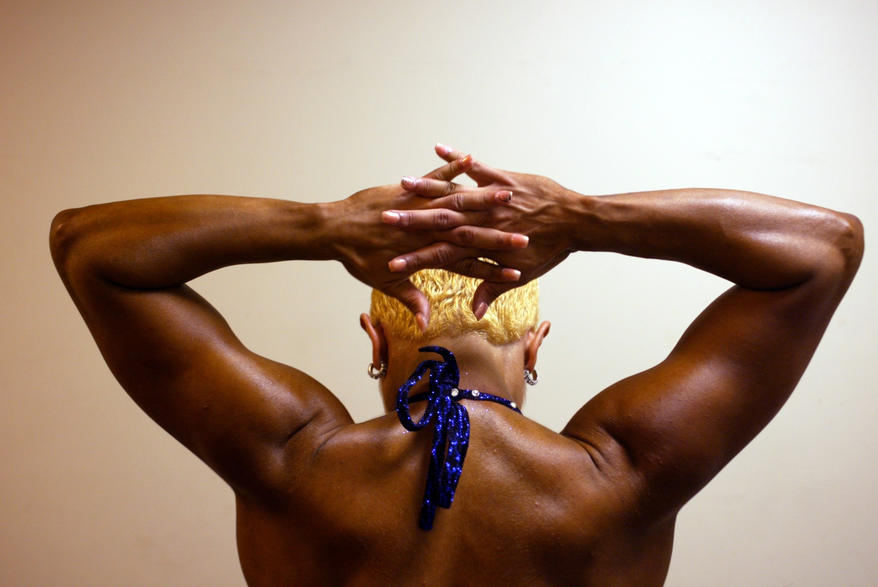 a women stretching her shoulder muscles