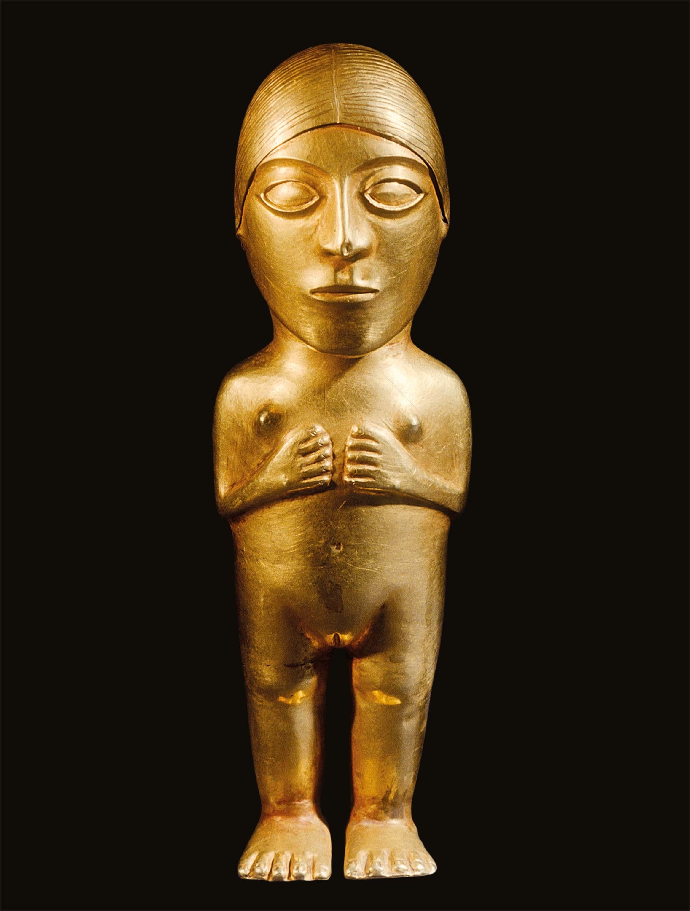 This 13th-16th century golden girl is made of several sheets of hammered metal soldered together.