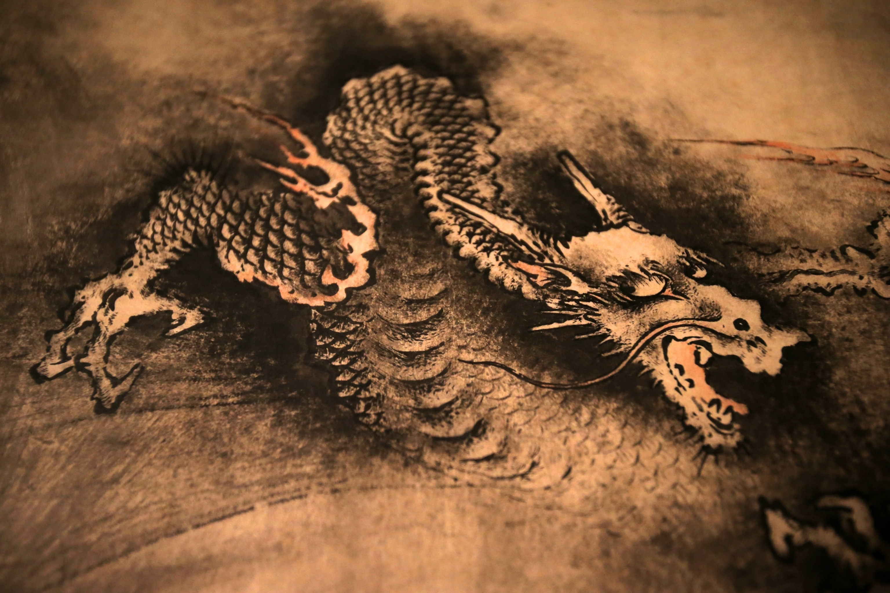 A Chinese dragon drawn in black ink.