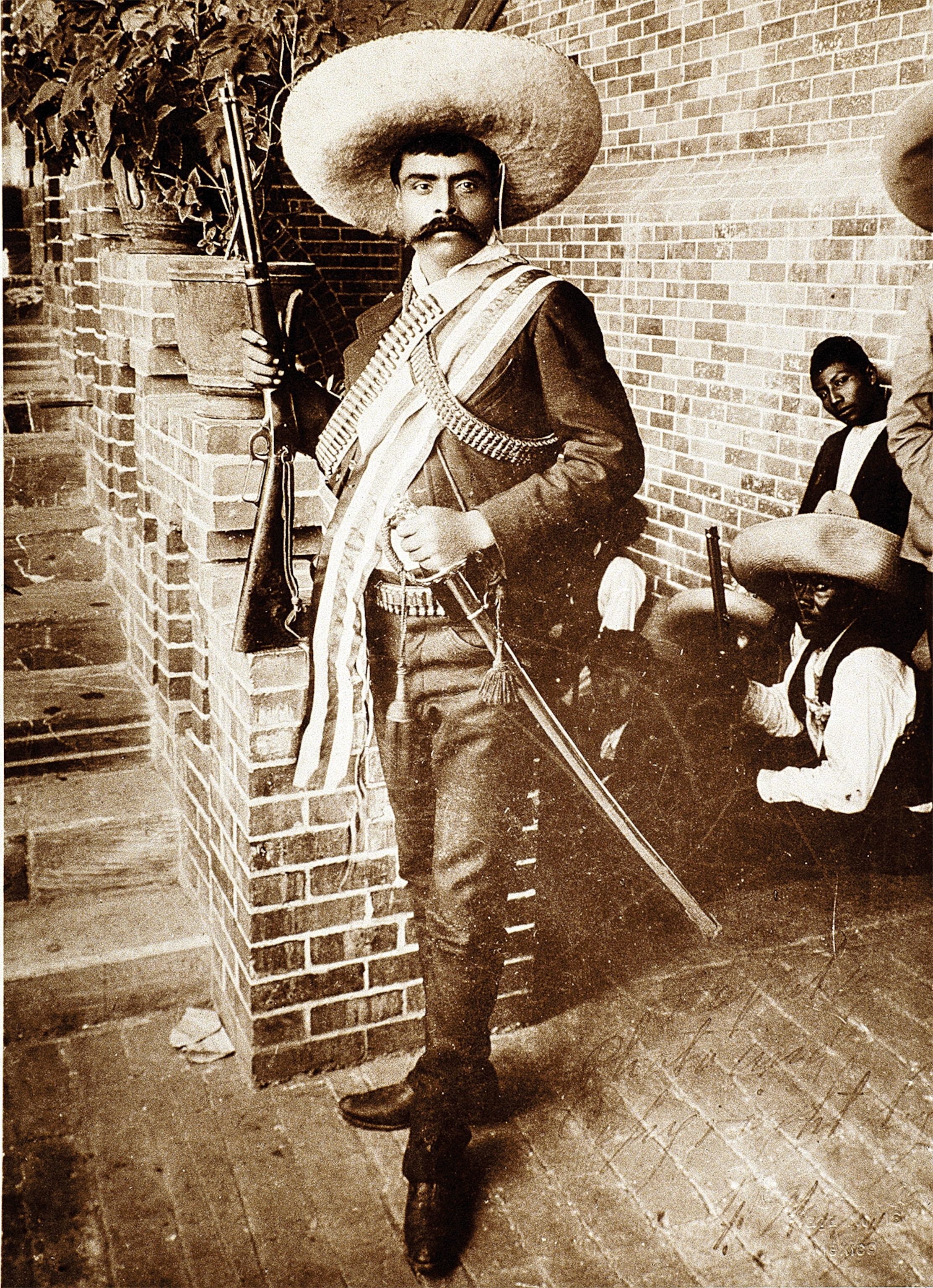 Emiliano Zapata stands in his barracks in 1911, wearing his signature charro hat.