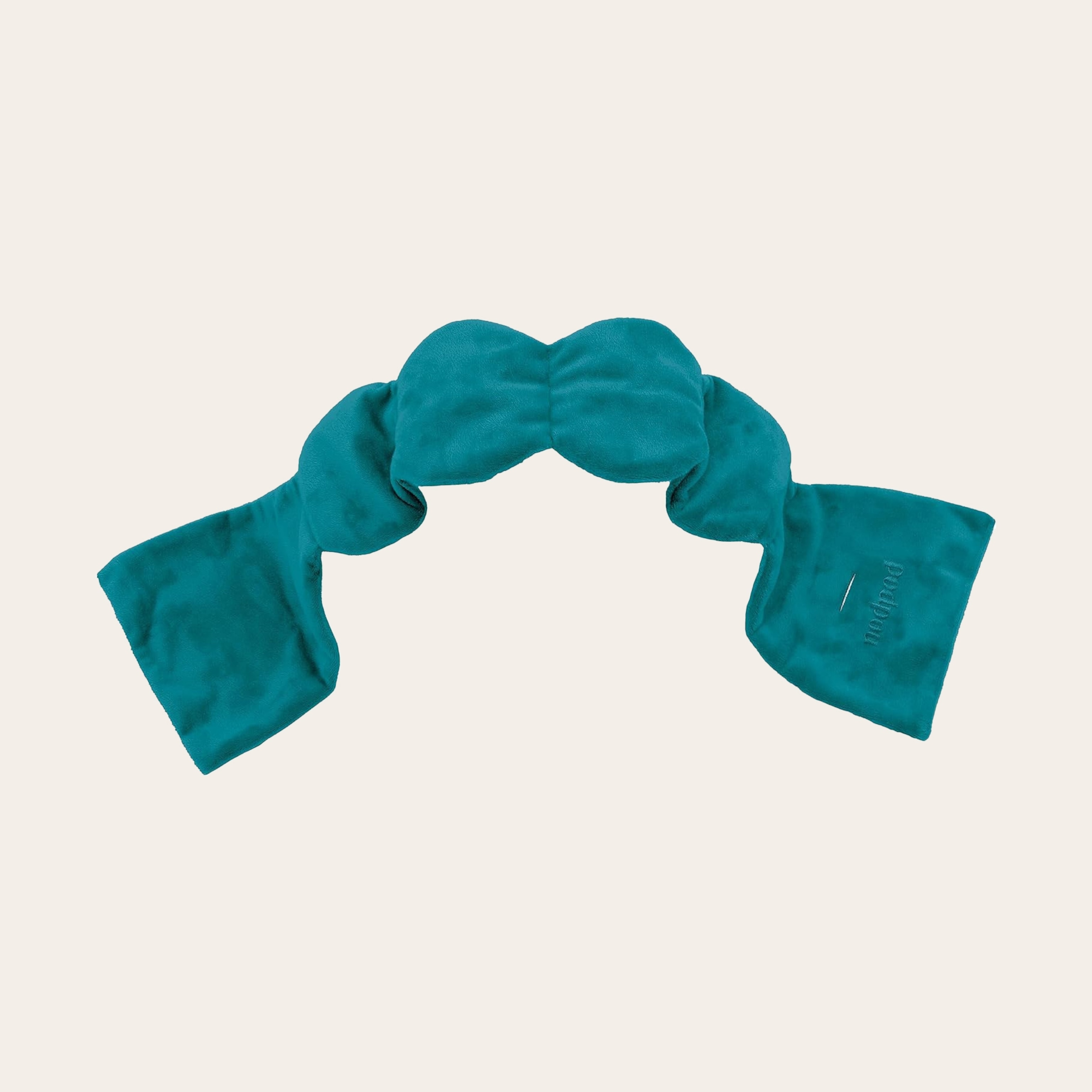 Teal soft fabric on a cream background.