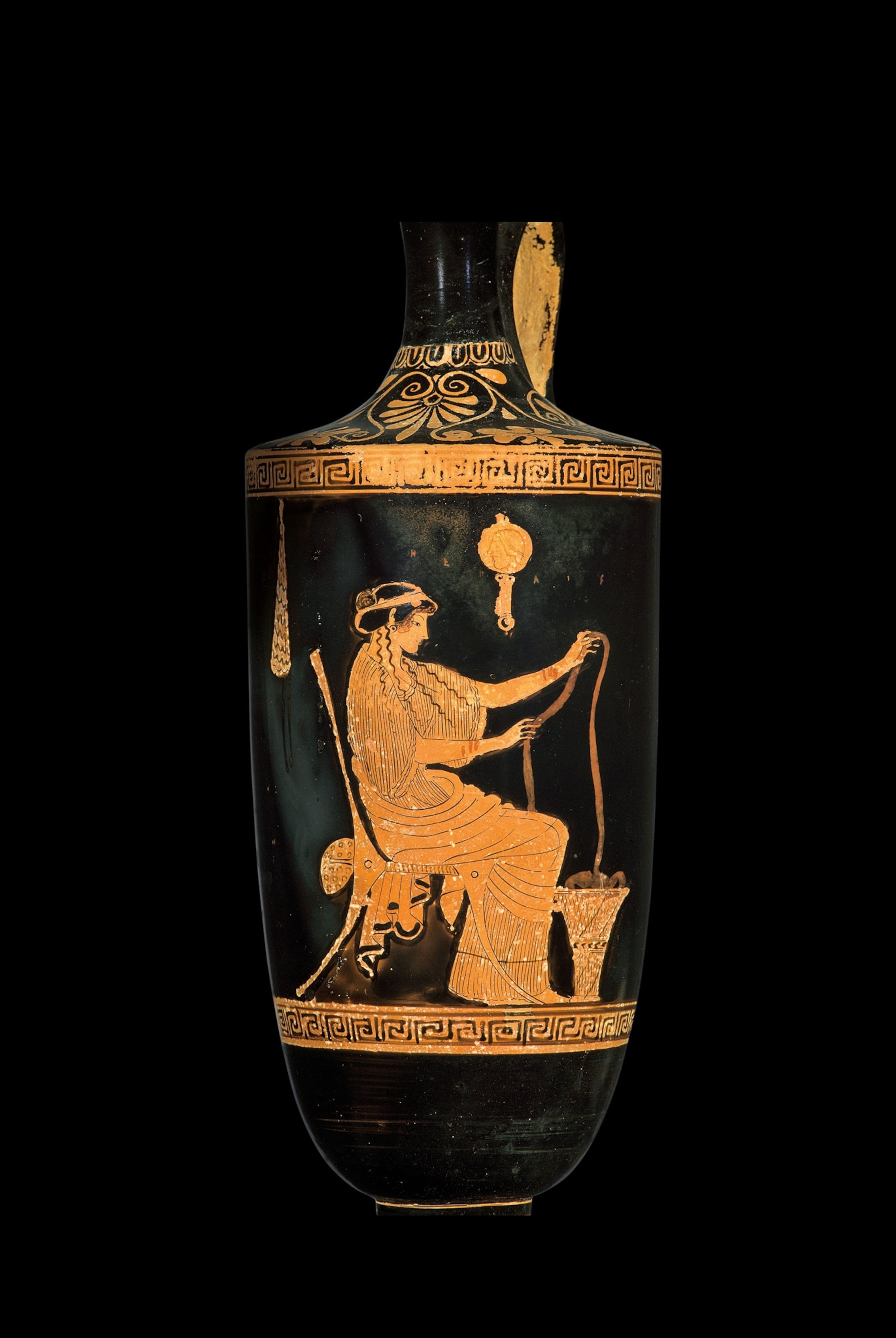 a woman shown working wool on this fifth-century B.C. oil flask