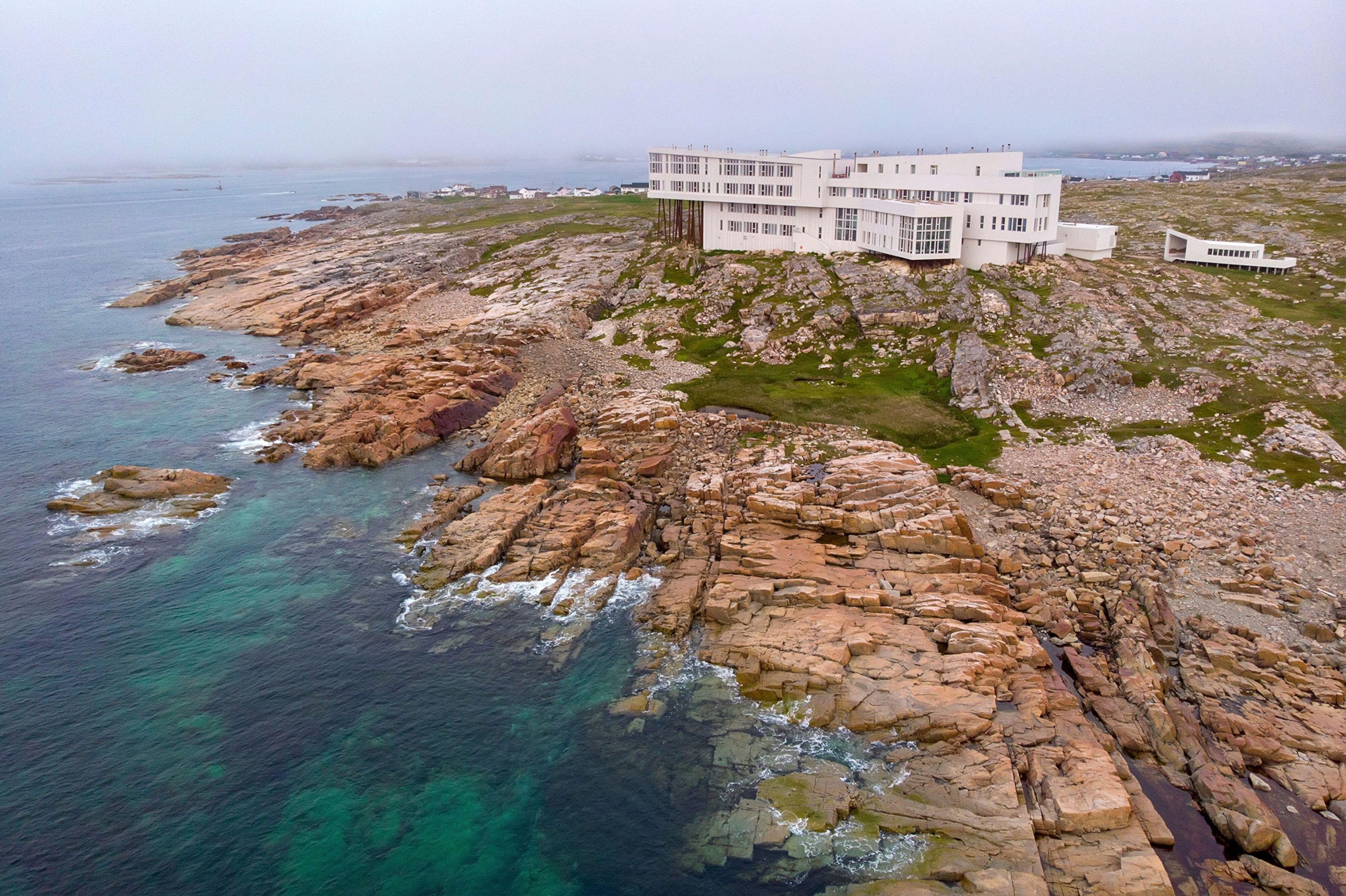 Aerial shot of the Fogo Island Inn on a foggy day