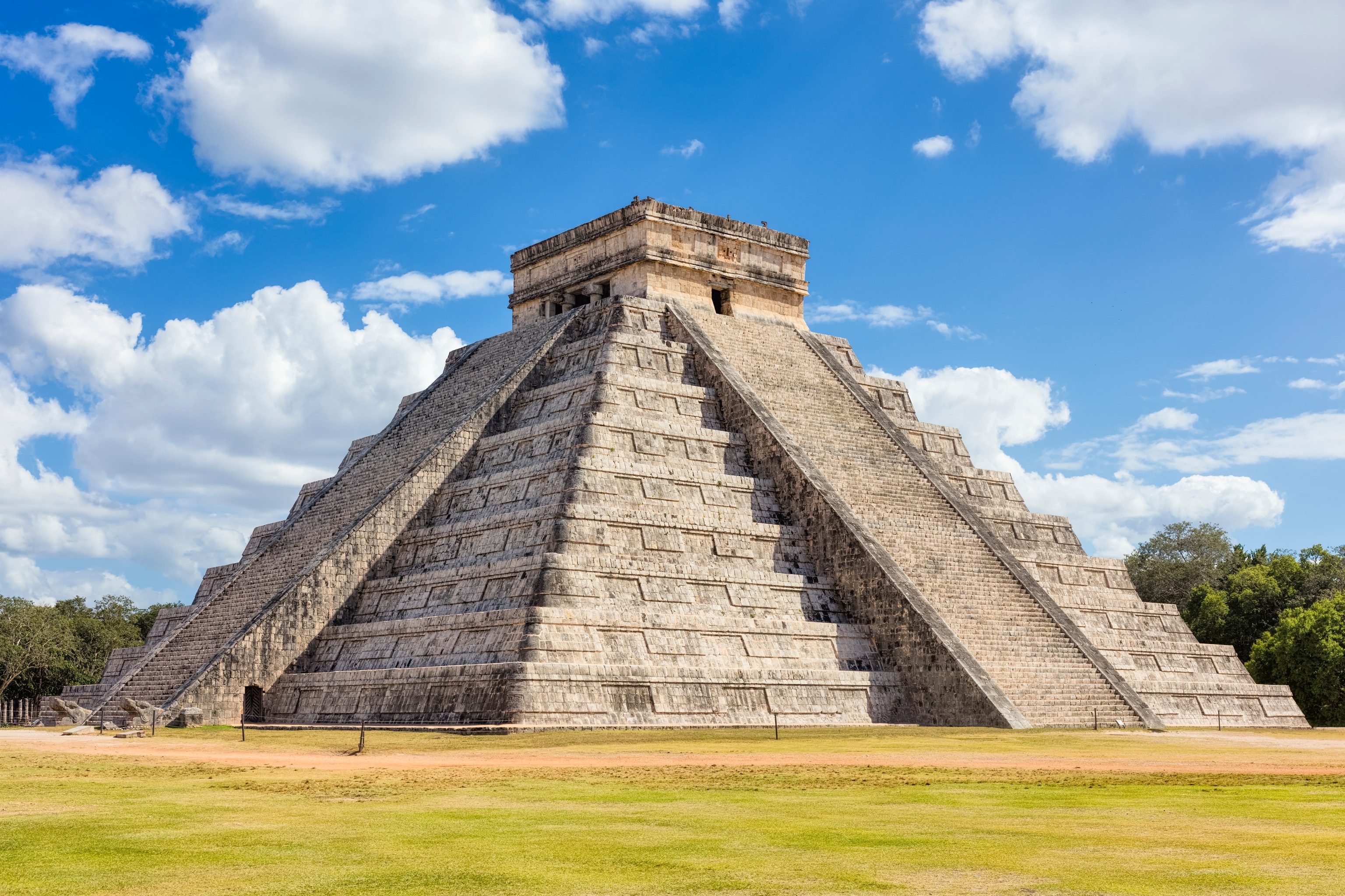 A mayan ruin also known as the Temple of Kukulcan. It is a Mesoamerican step-pyramid which dominates the land.