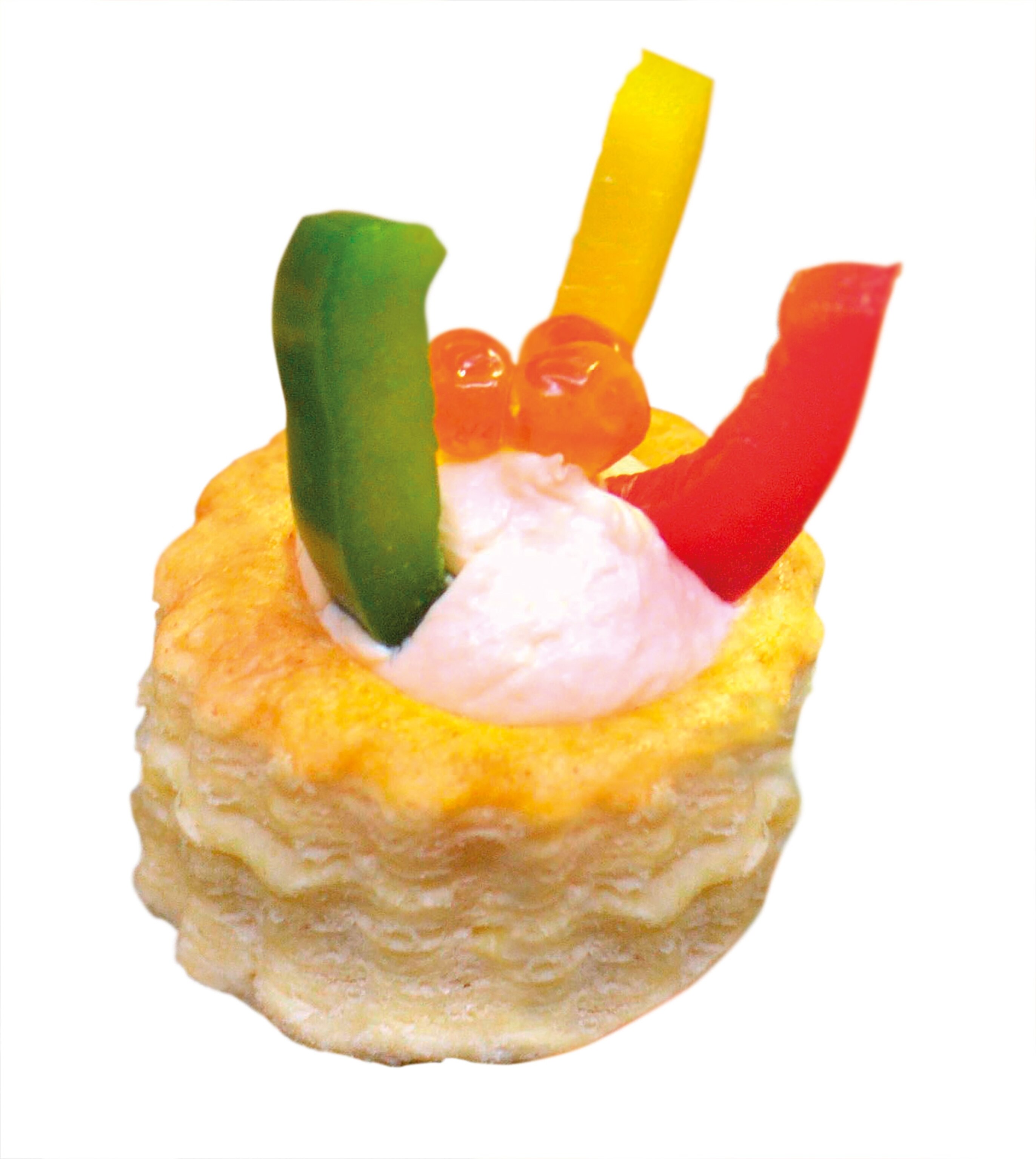 The vol-au-vent, with colorful peppers on top, is puff pastry filled with savory flavors.