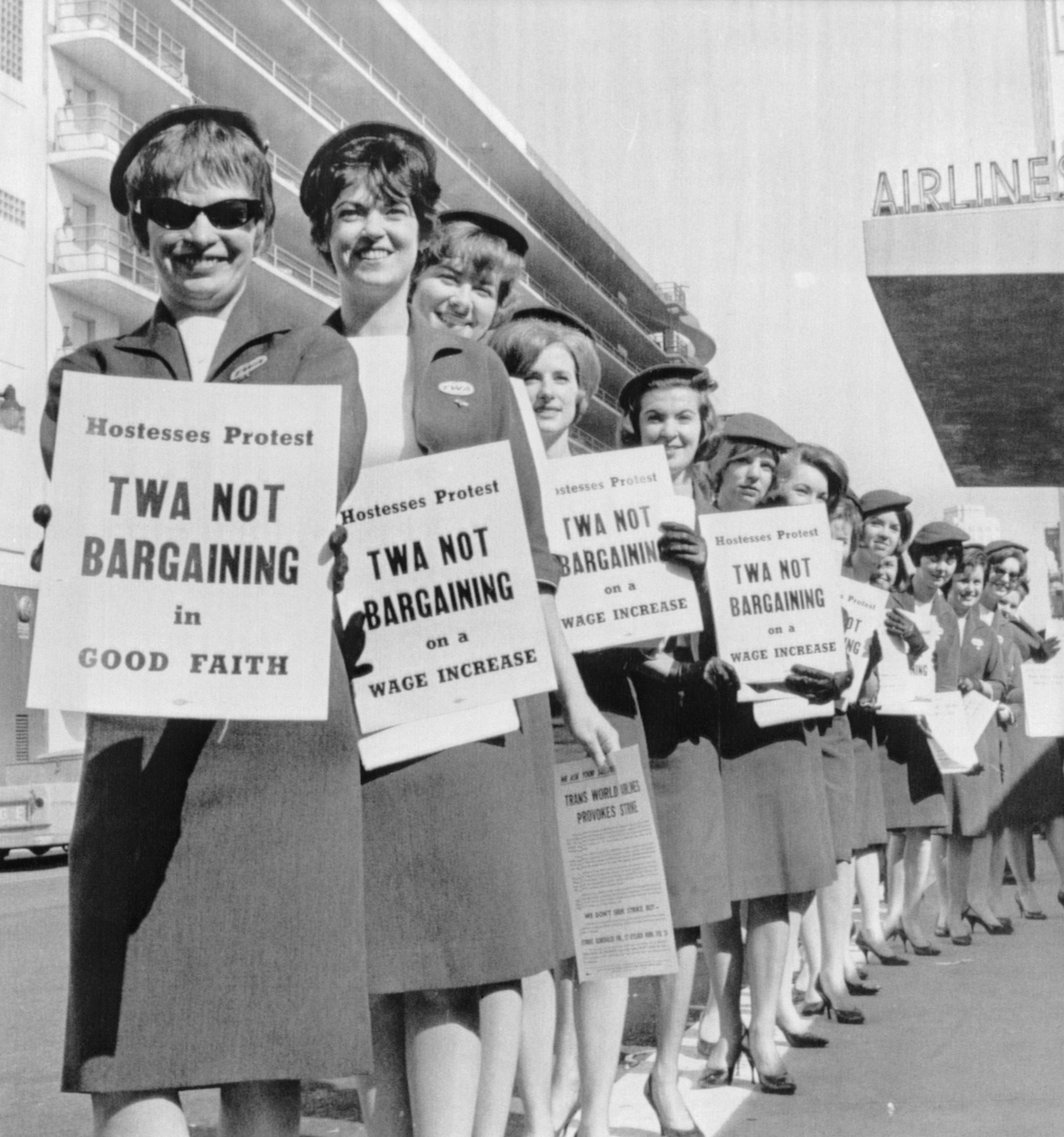 archival photo of TWA Flight Attendants with signs during a Demonstration