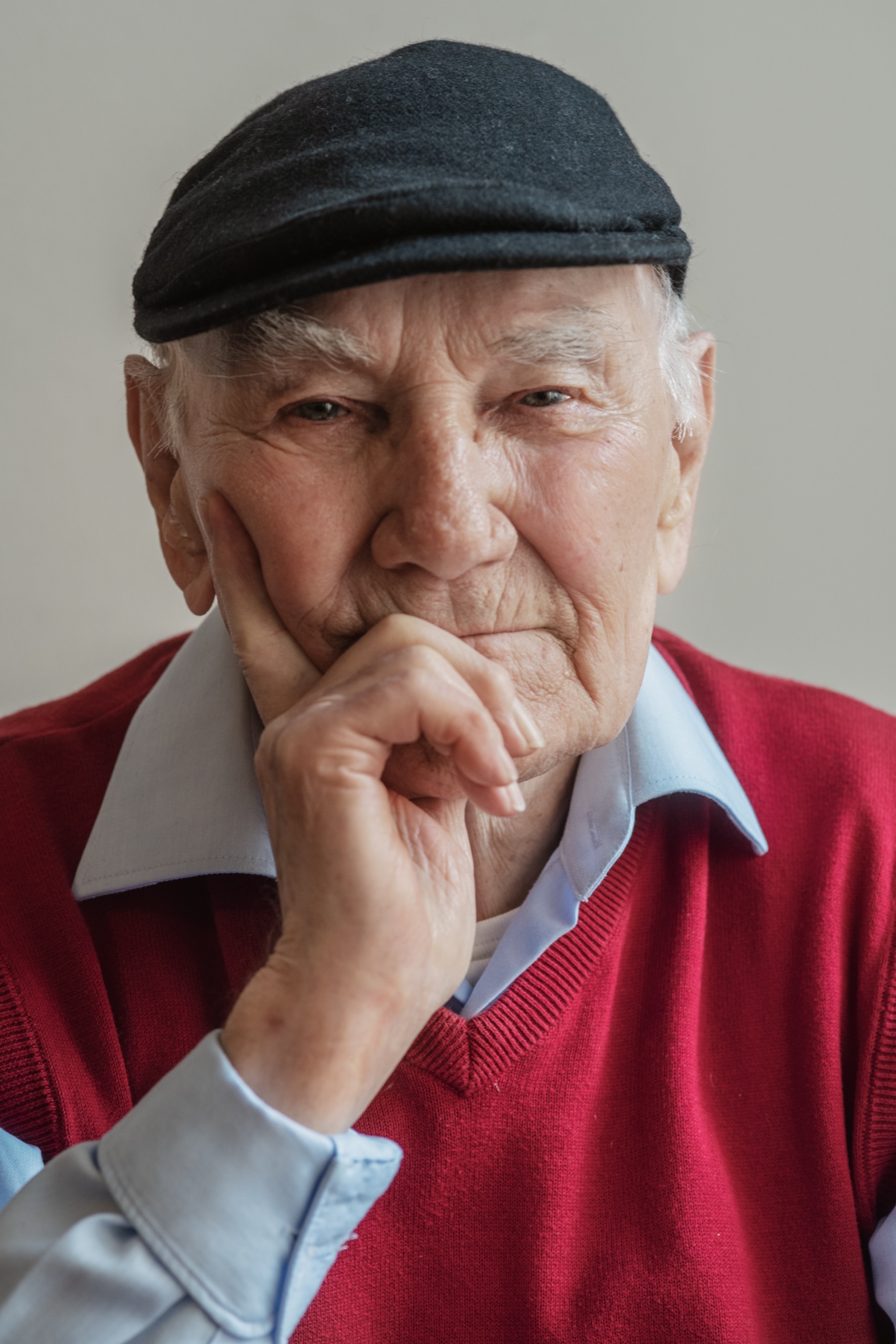 Picture a man in red sweater wearing a portrait