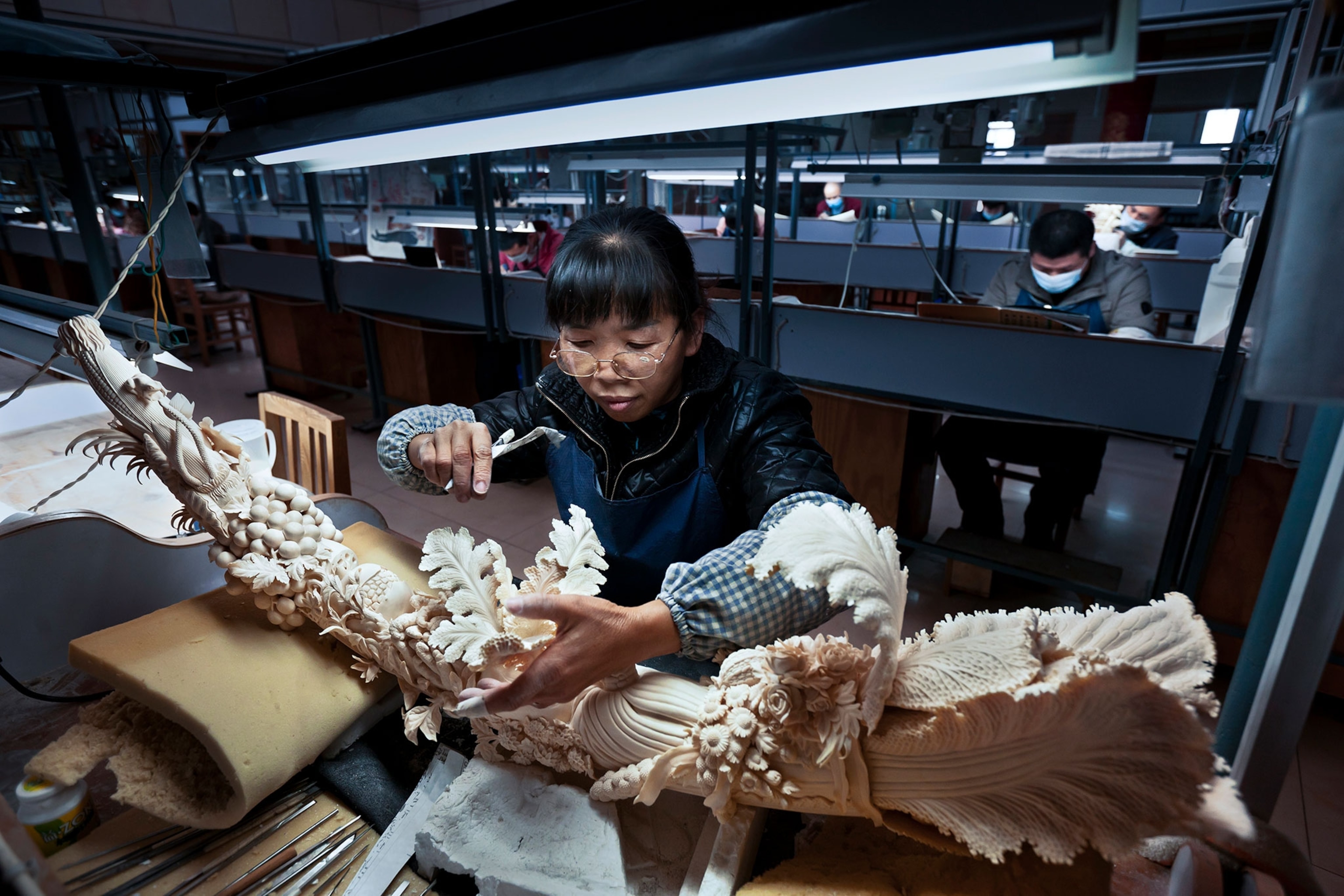 an ivory-carving factory worker