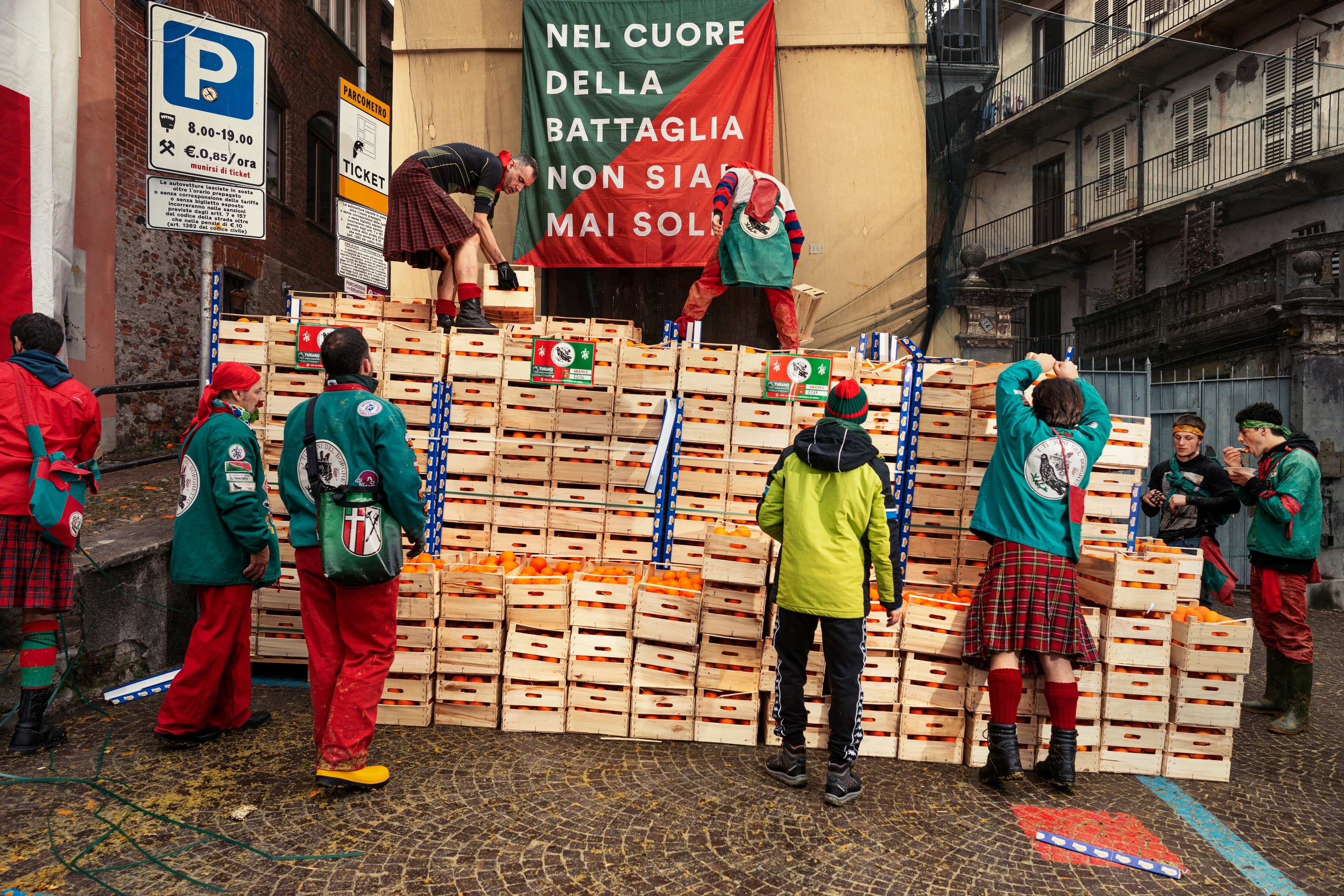 Preparations before the Battle of the Oranges in the historic Borghetto neighborhood.