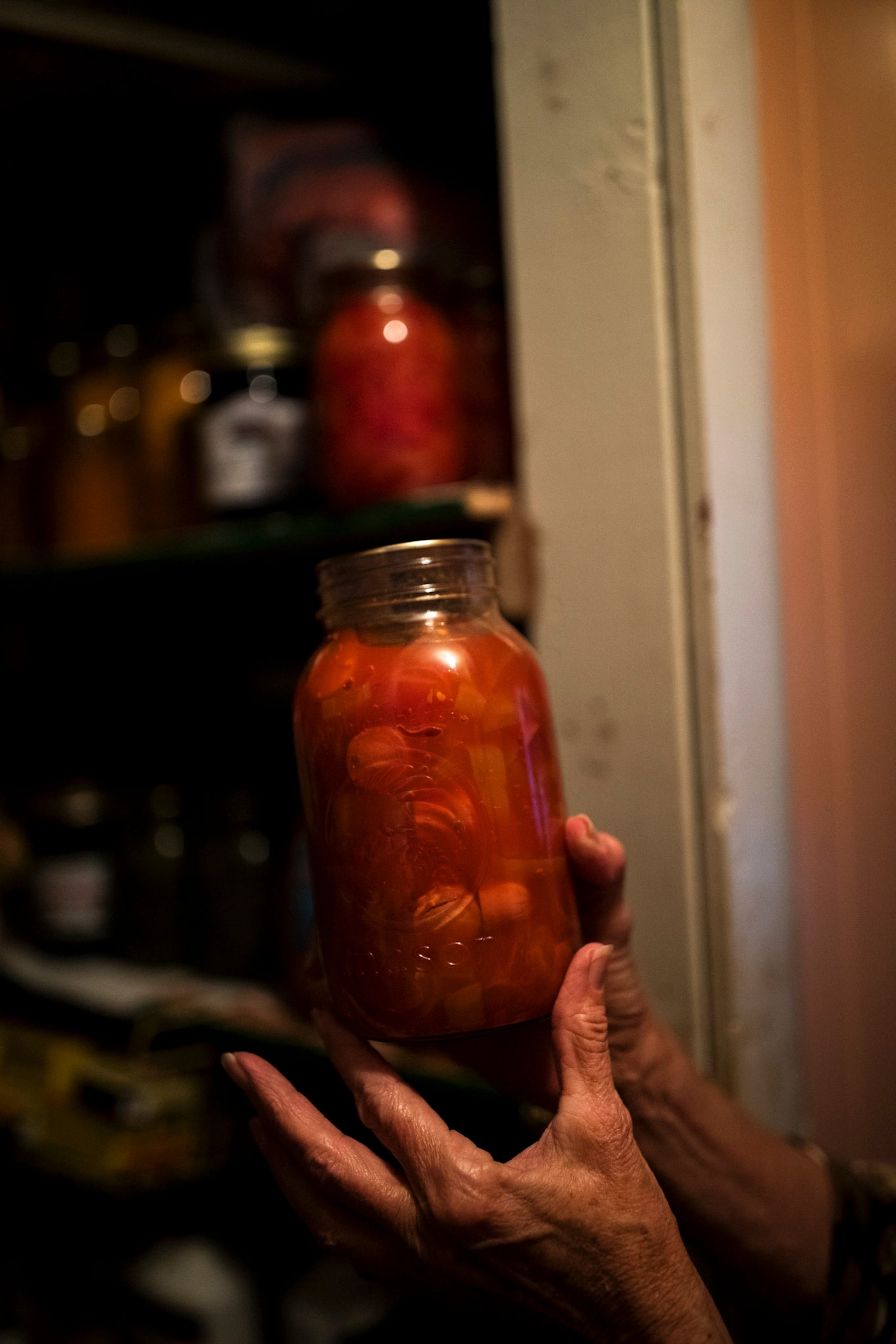 a woman holds canned vegetables