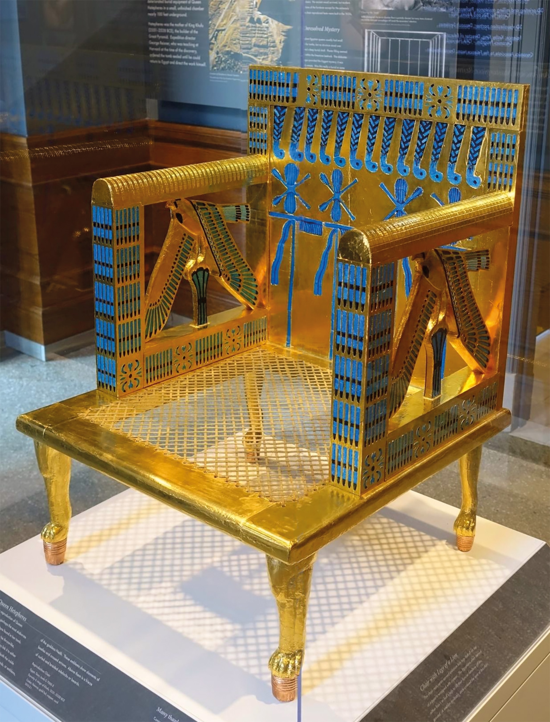 Hetepheres's carrying chair, made of gilded wood with inlaid faience, includes decorations of falcons perched on papyrus columns.