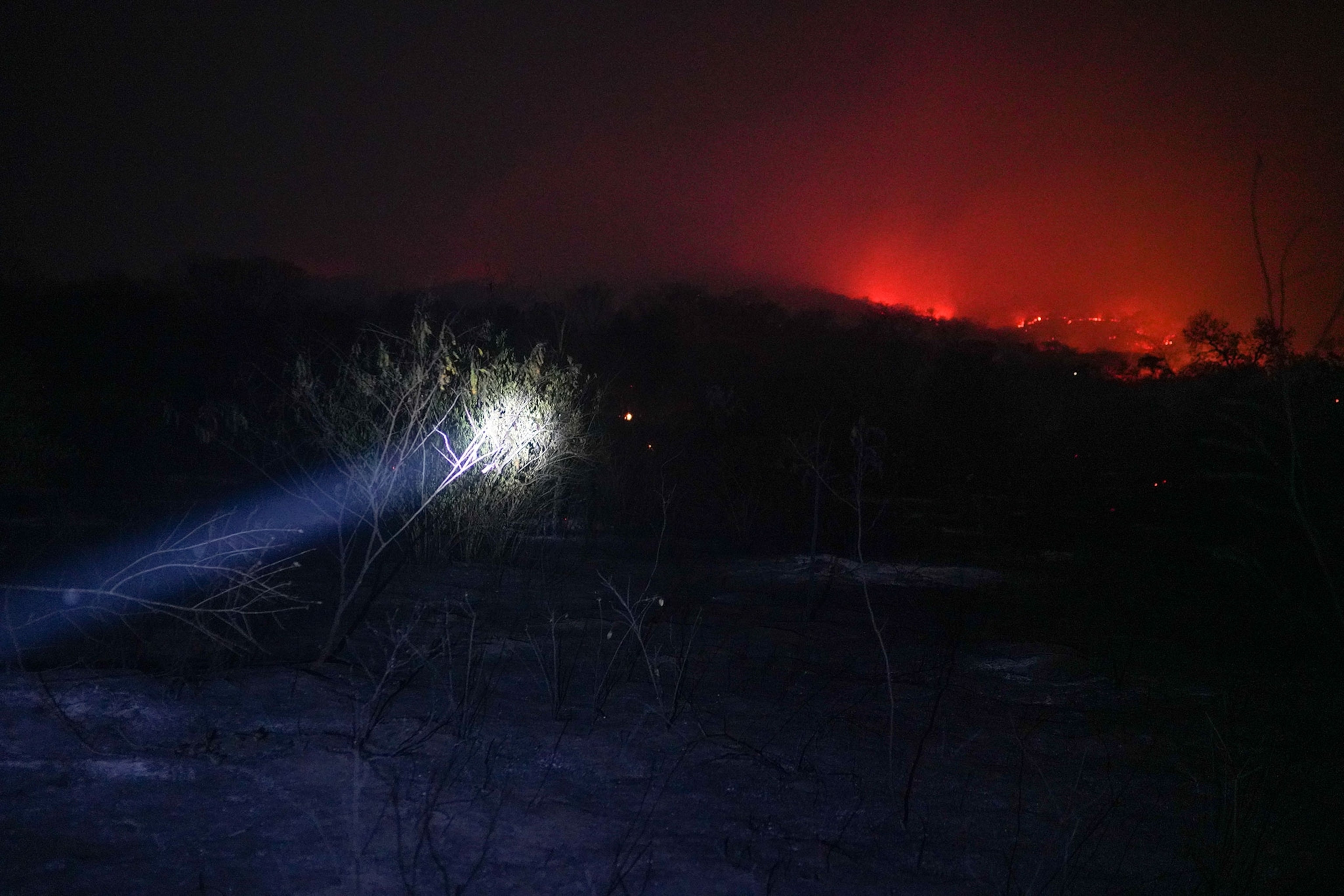 a flashlight illuminating the fires ahead