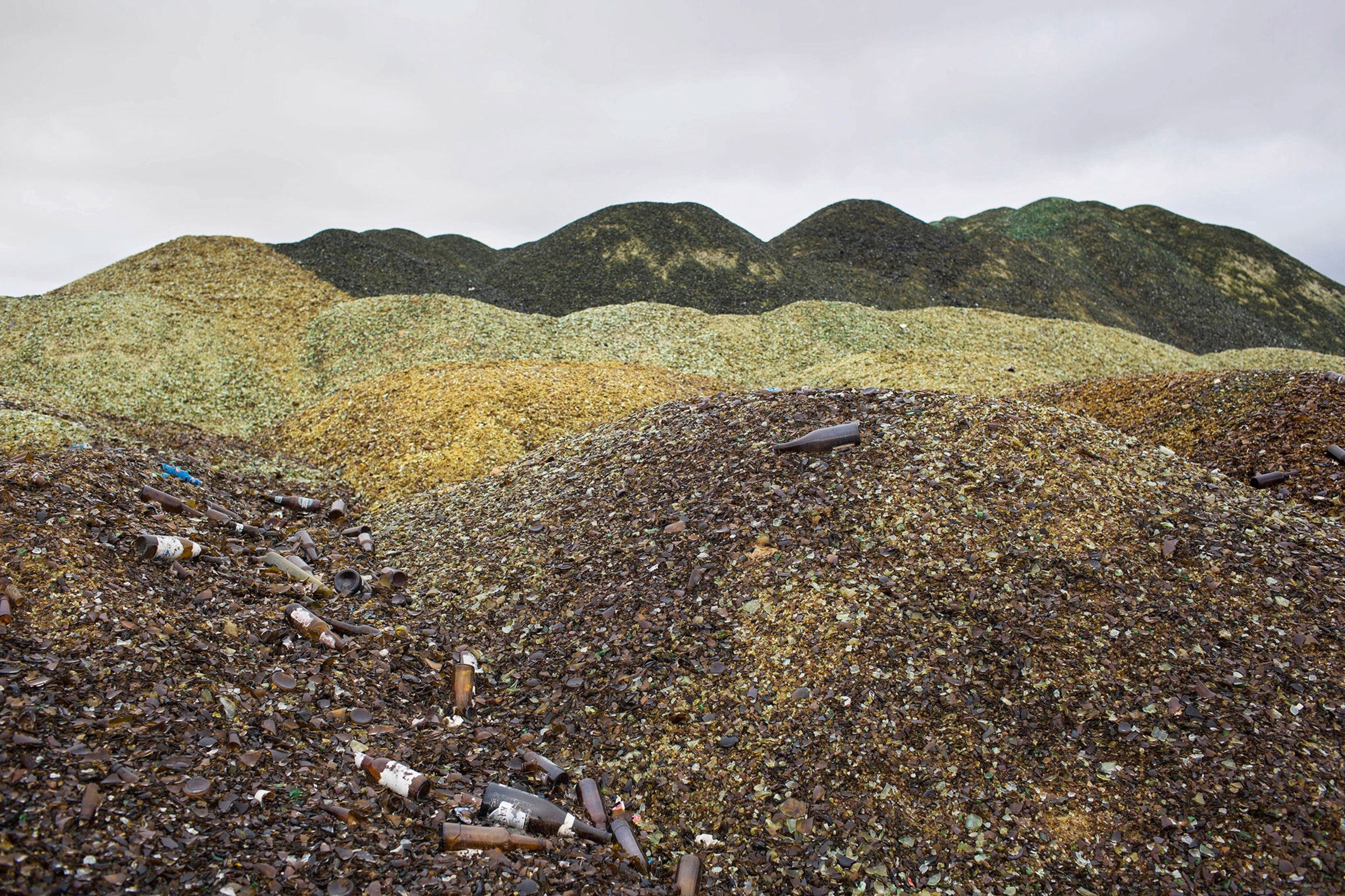 piles of brown and green glass