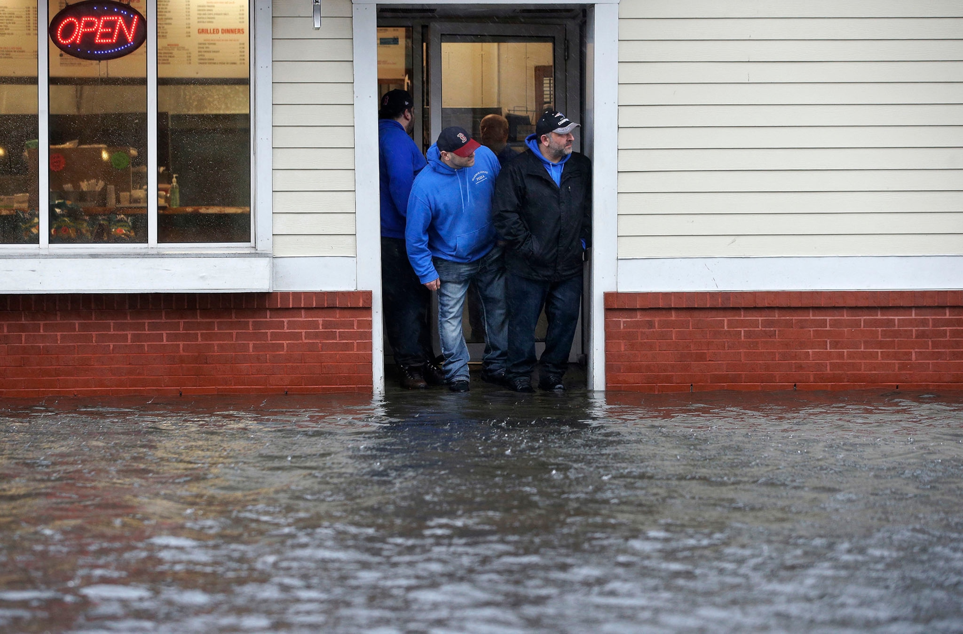 high waters and people dealing with a nor'easter storm