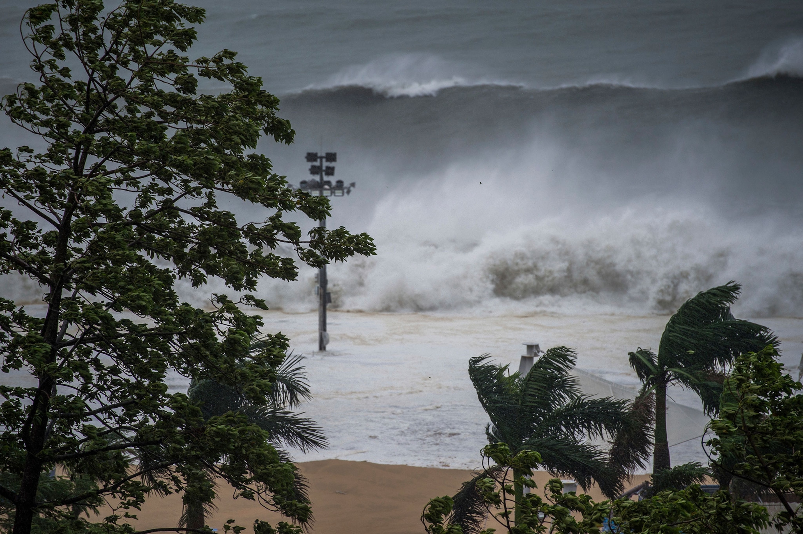 enormous waves from a tidal bore surge past the coast