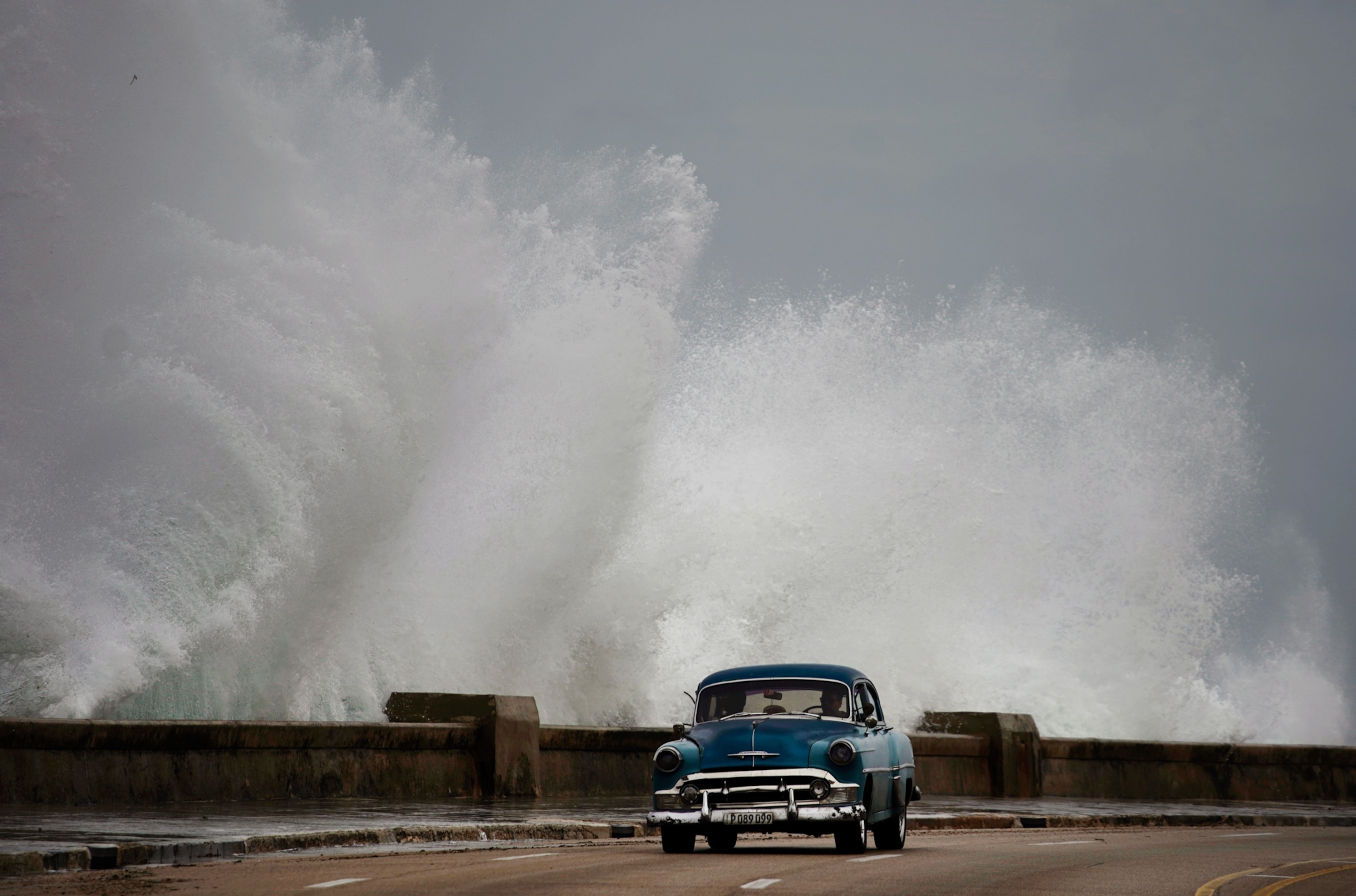 waves crashing against the Malecon, triggered by Hurricane Michael