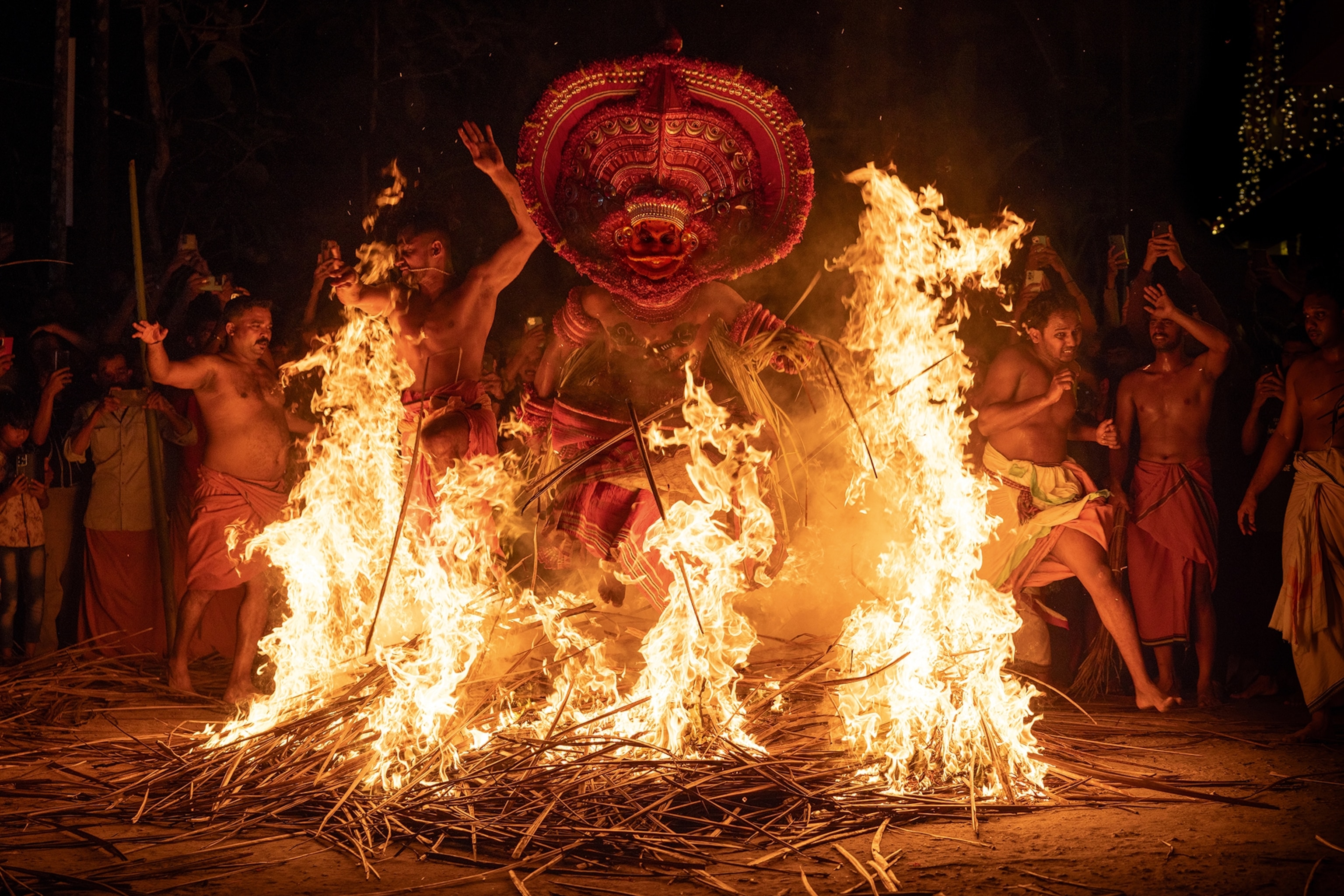 A group of men partaking in a religious ceremony in India.