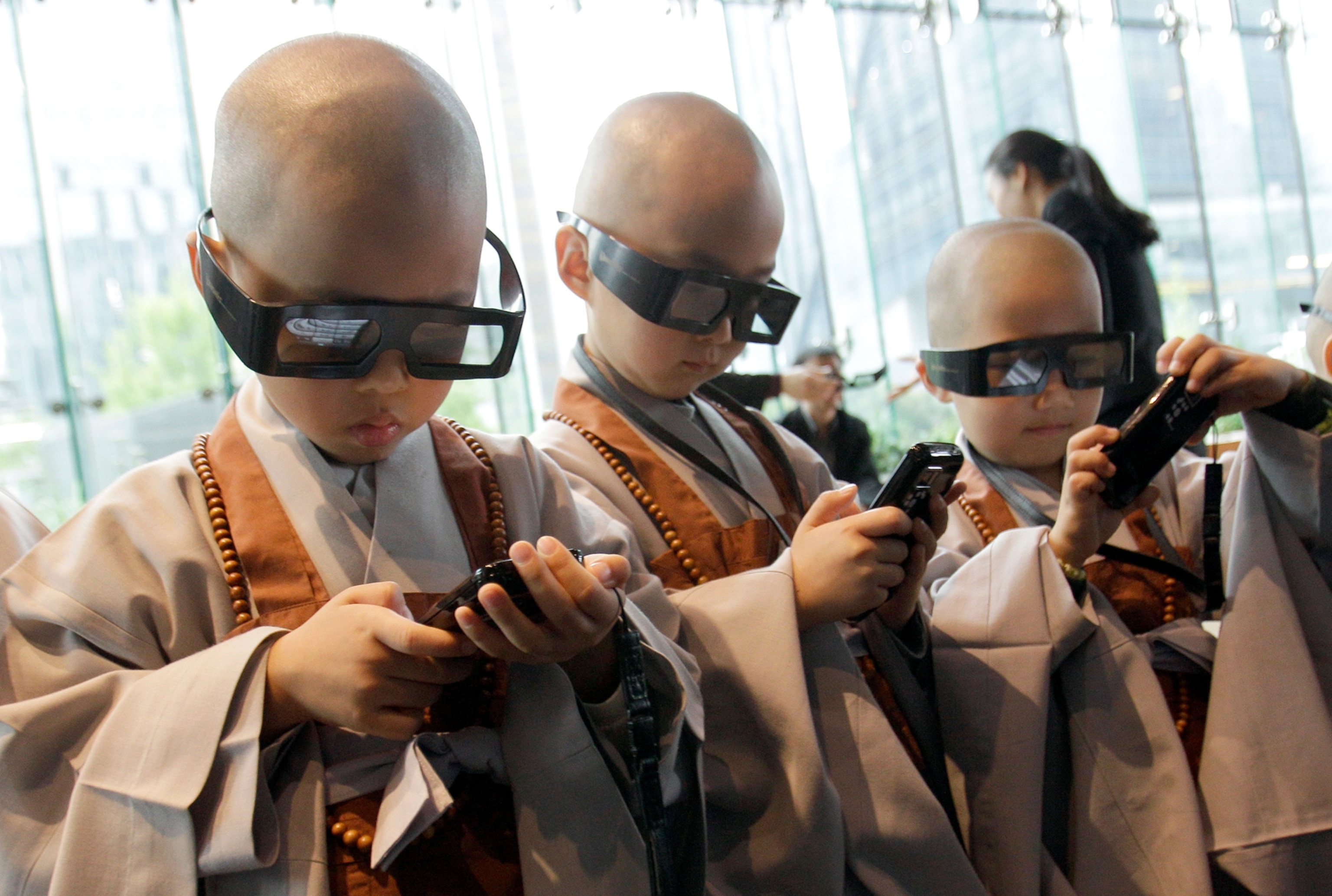 Young Korean boys in Seoul participate in a Buddhist training camp experience and use 3D glasses and smartphones to learn about their faith.