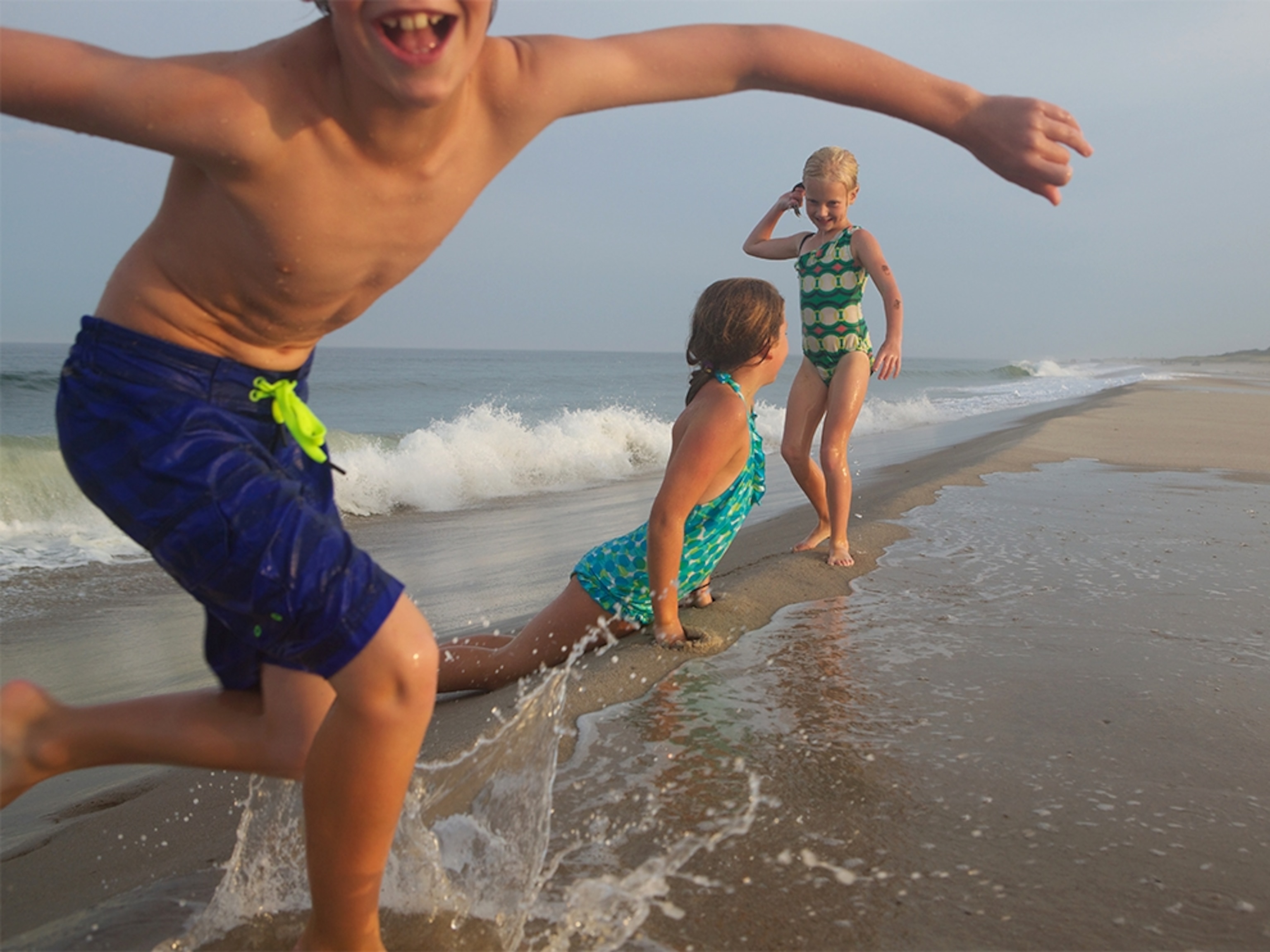kids playing in Nauset Beach in Orleans, Massachusetts