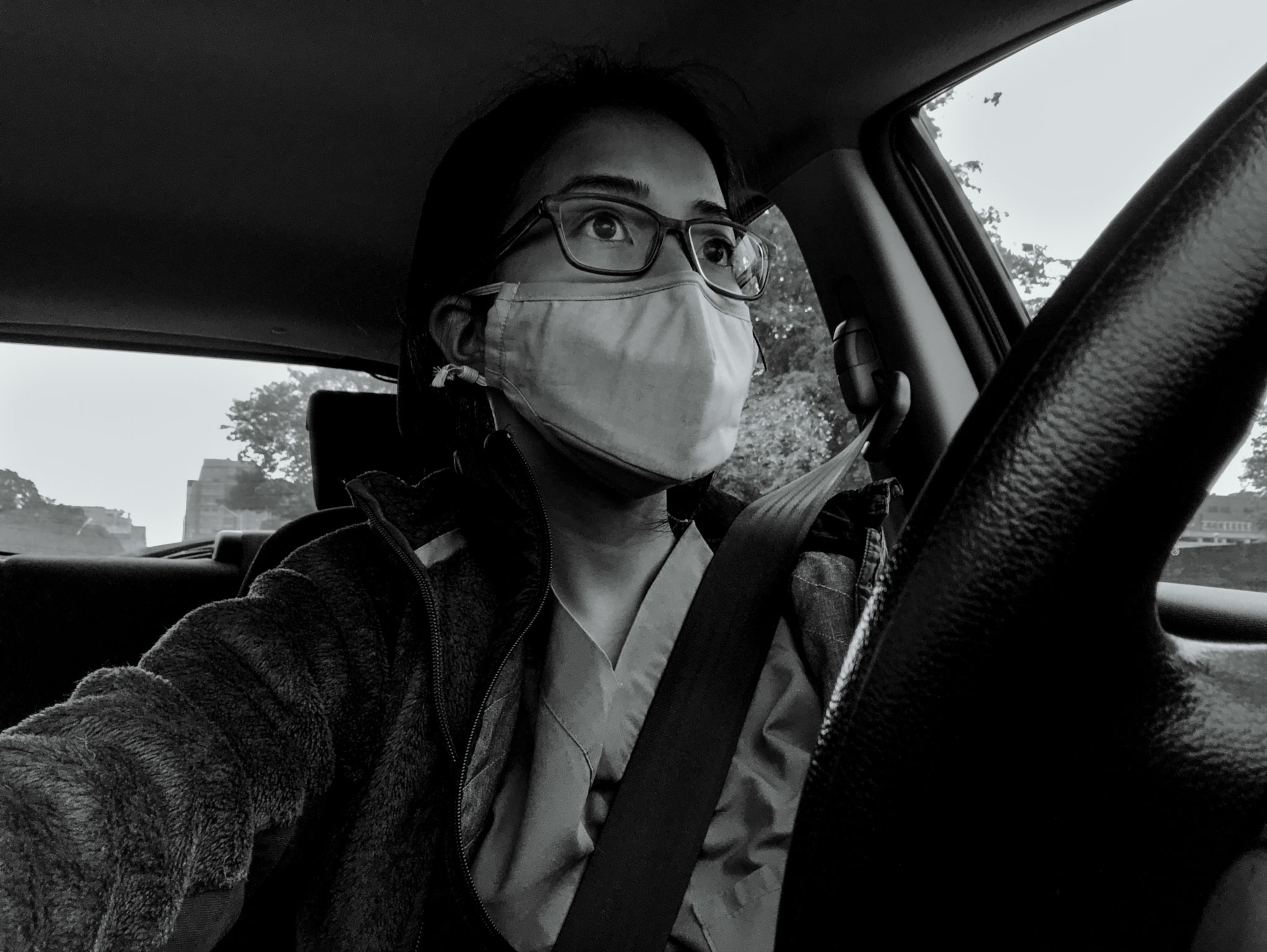 a nurse in her car