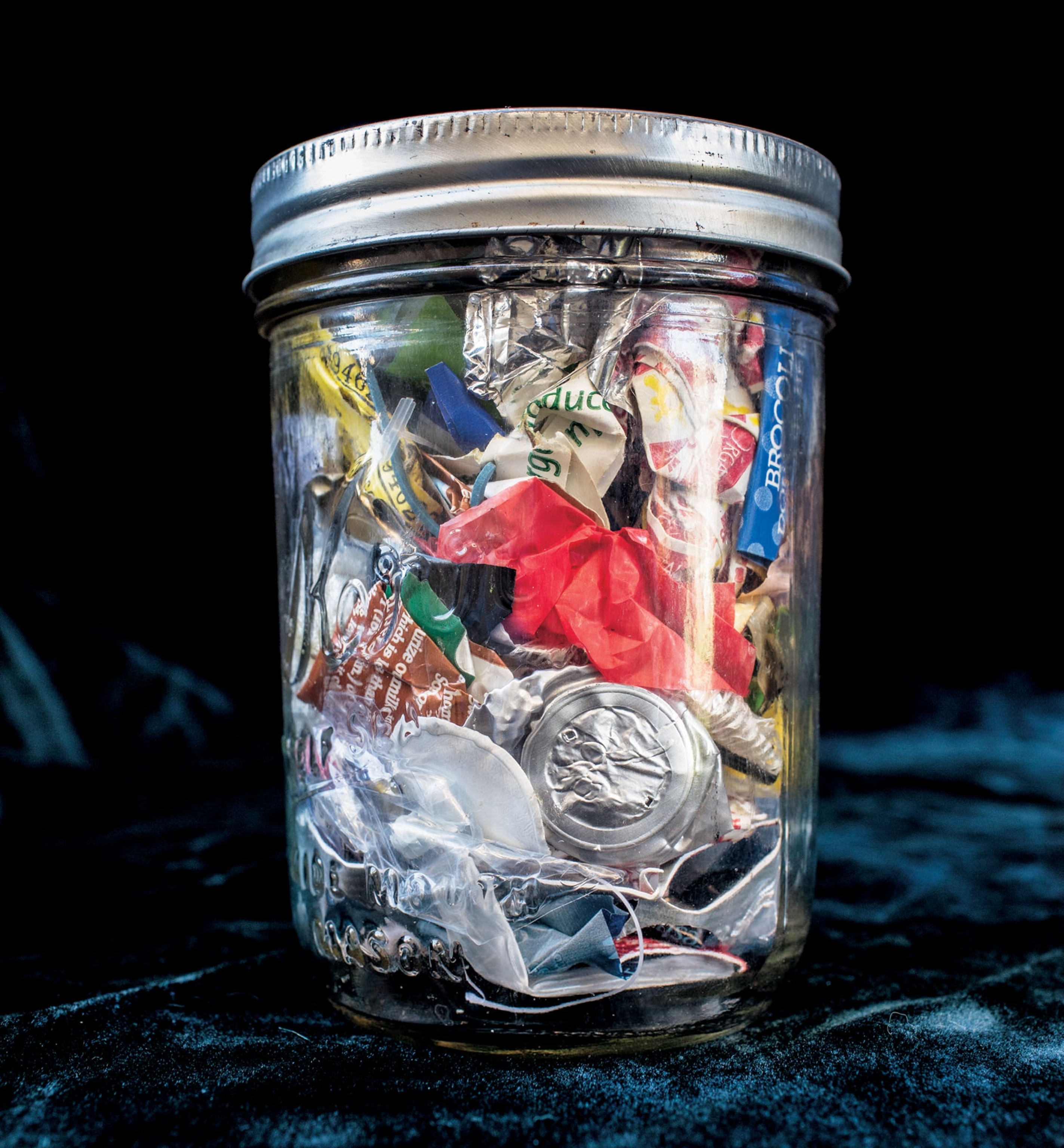 a jar containing small pieces of garbage