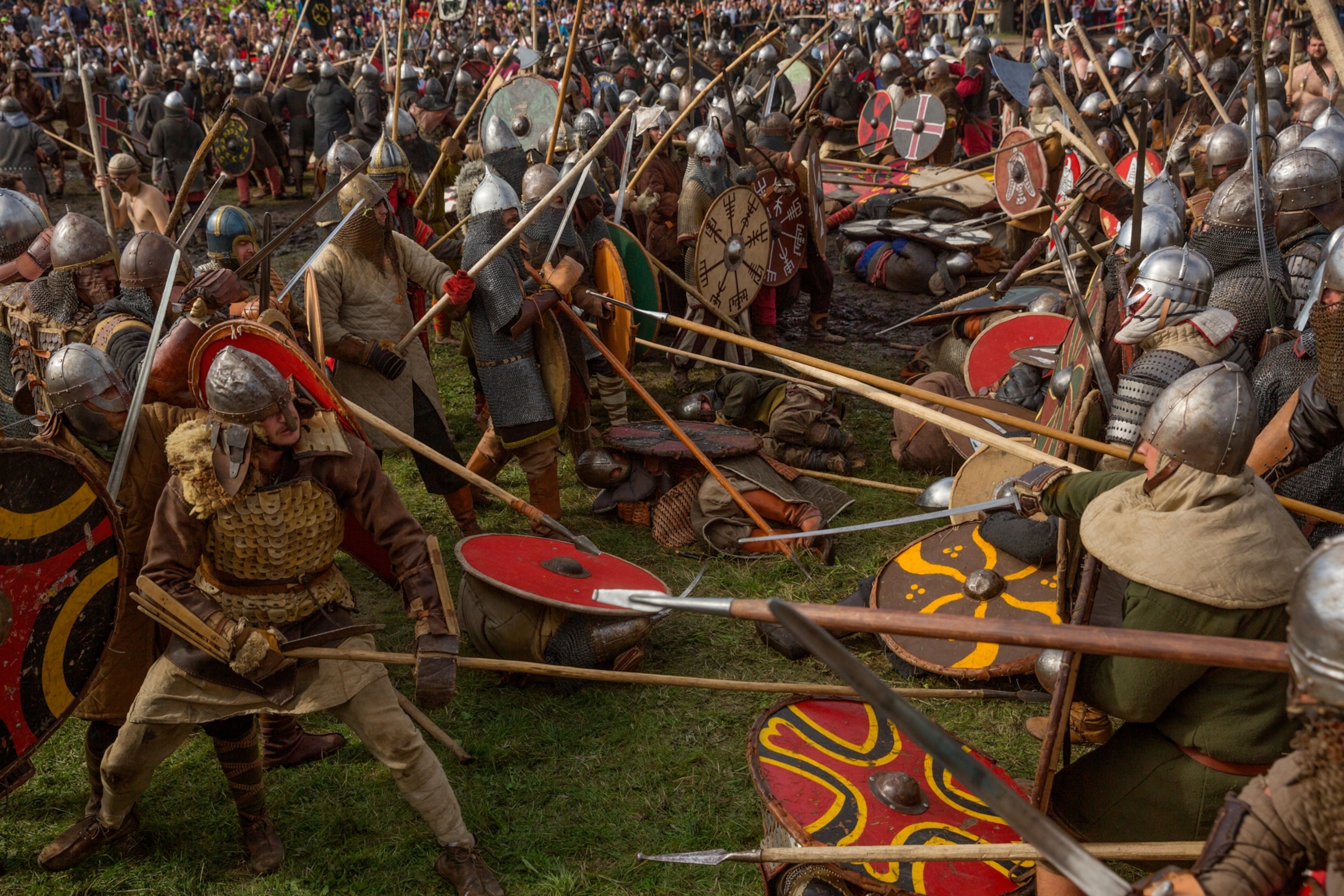 Re-enactors don armor and shields in preparation for close combat during at mock battle at the Festival of Slavs and Vikings in Wolin, Poland.