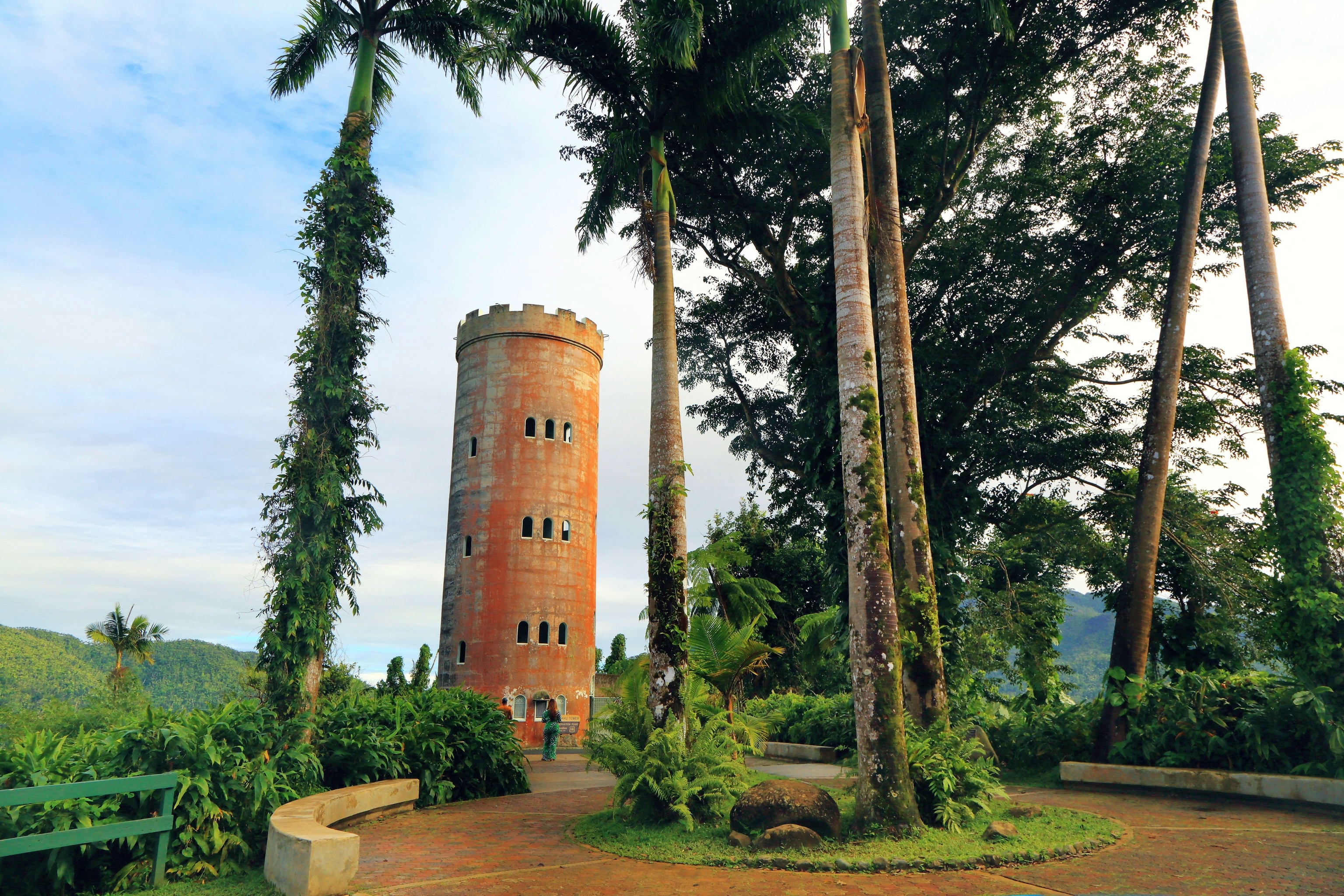 stone tower seen among a group of trees