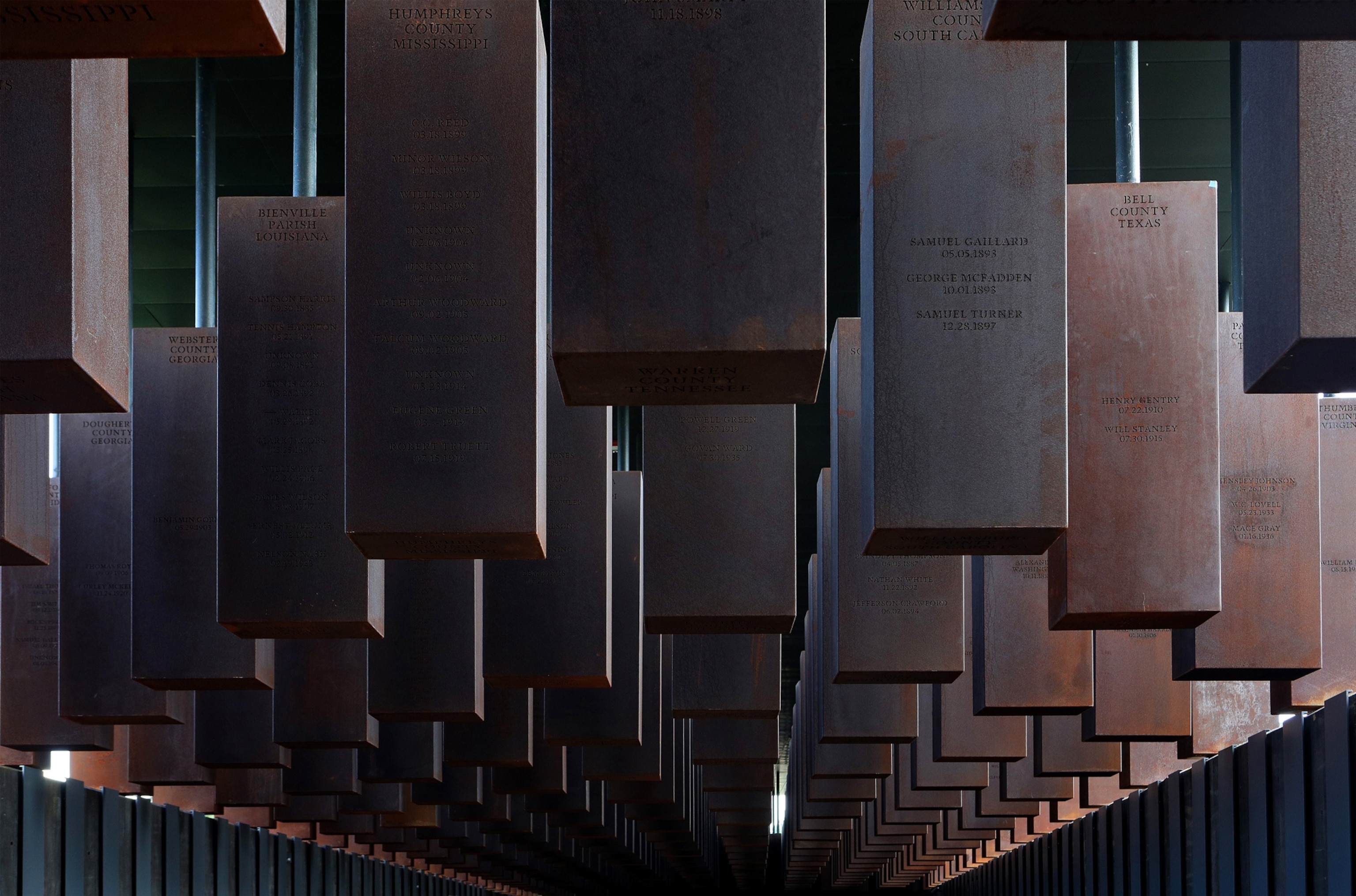 steel columns hanging from a ceiling