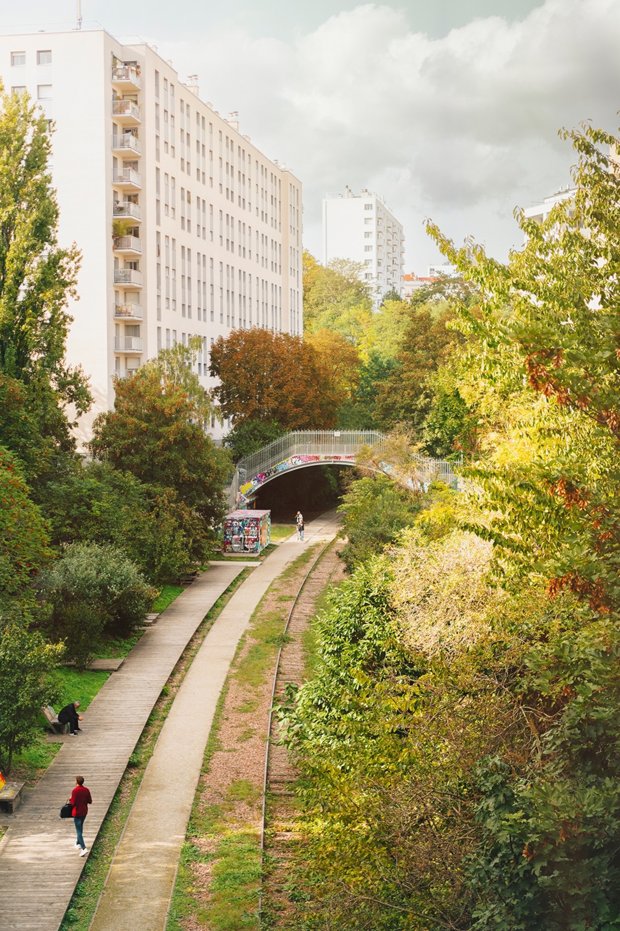 A railroad through a green oasis in the city of paris