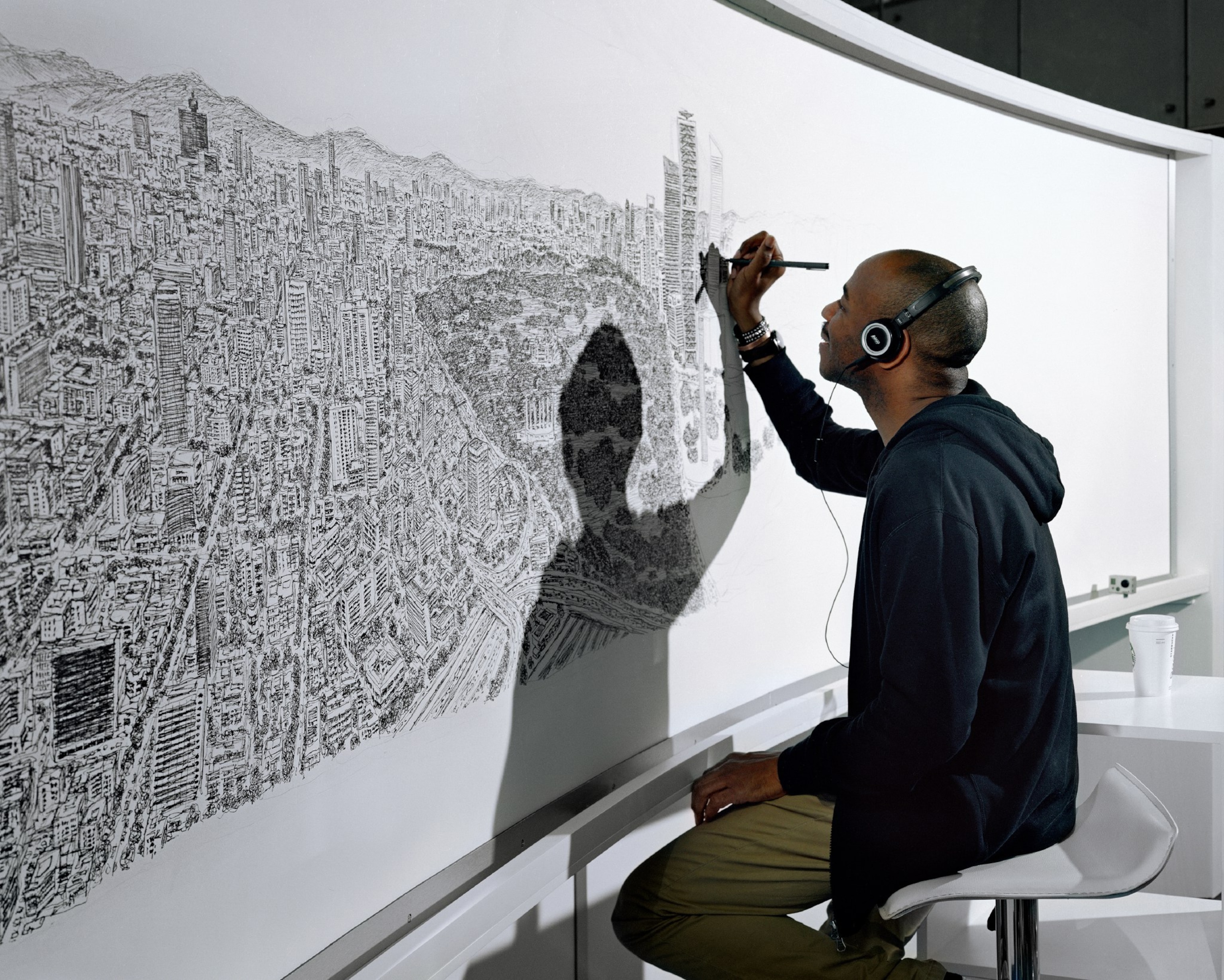 artist drawing map of Mexico City from memory.