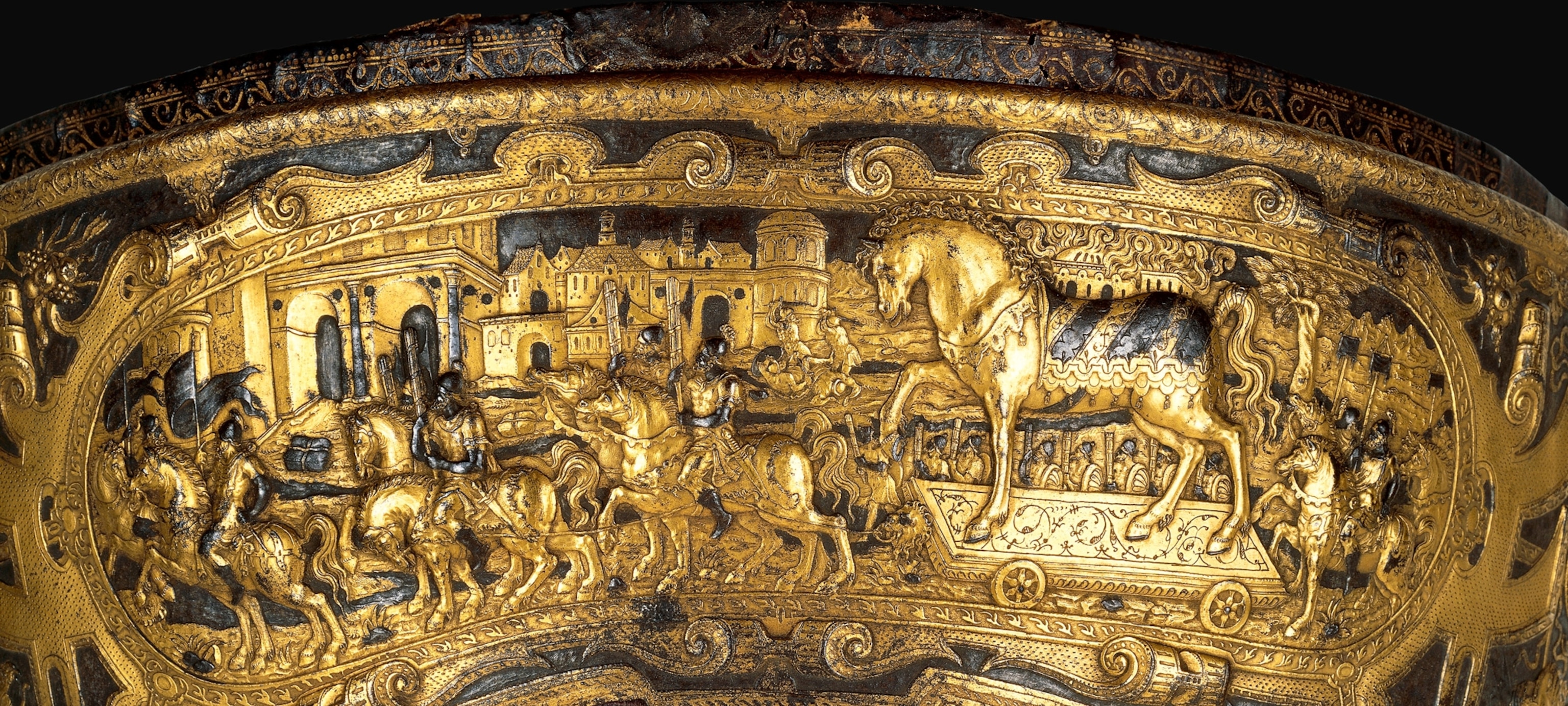 a 16th-century saddle showing the Trojans bringing the wooden horse into their city