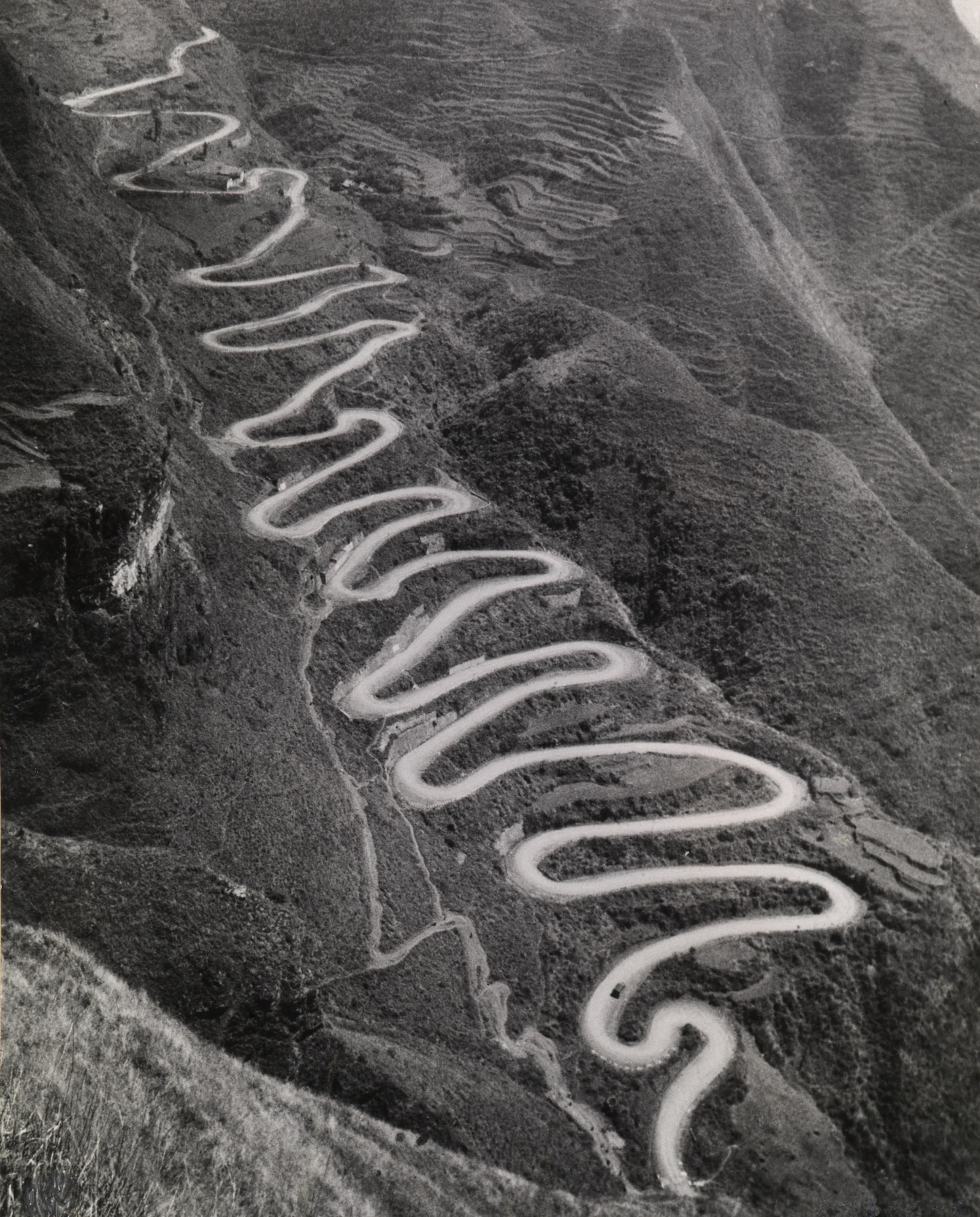 Photo of very windy road up mountainside