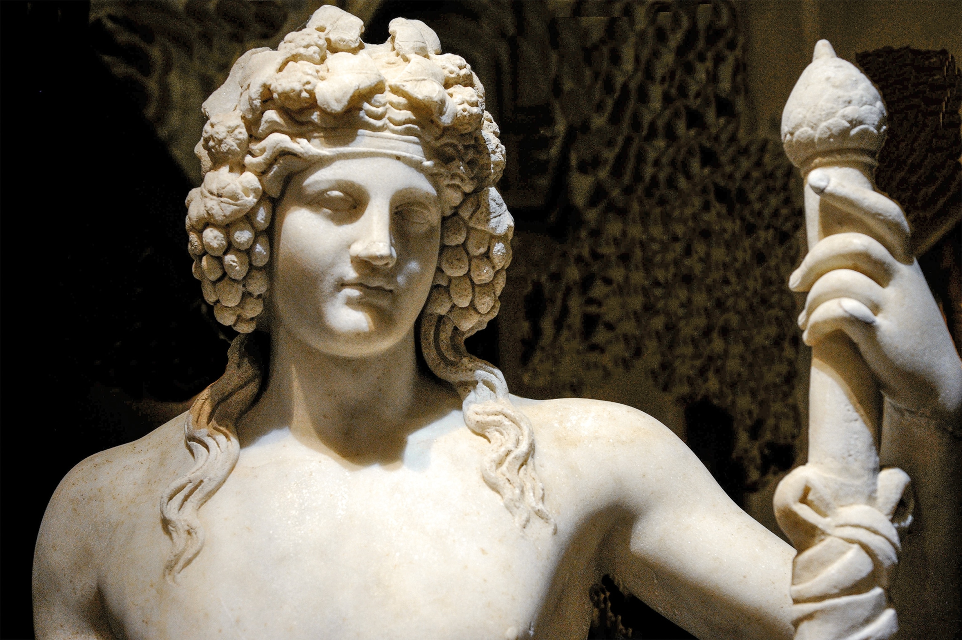 A youthful Dionysus is crowned with grapes in a first-century A.D. marble statue at the Naples Archaeological Museum.